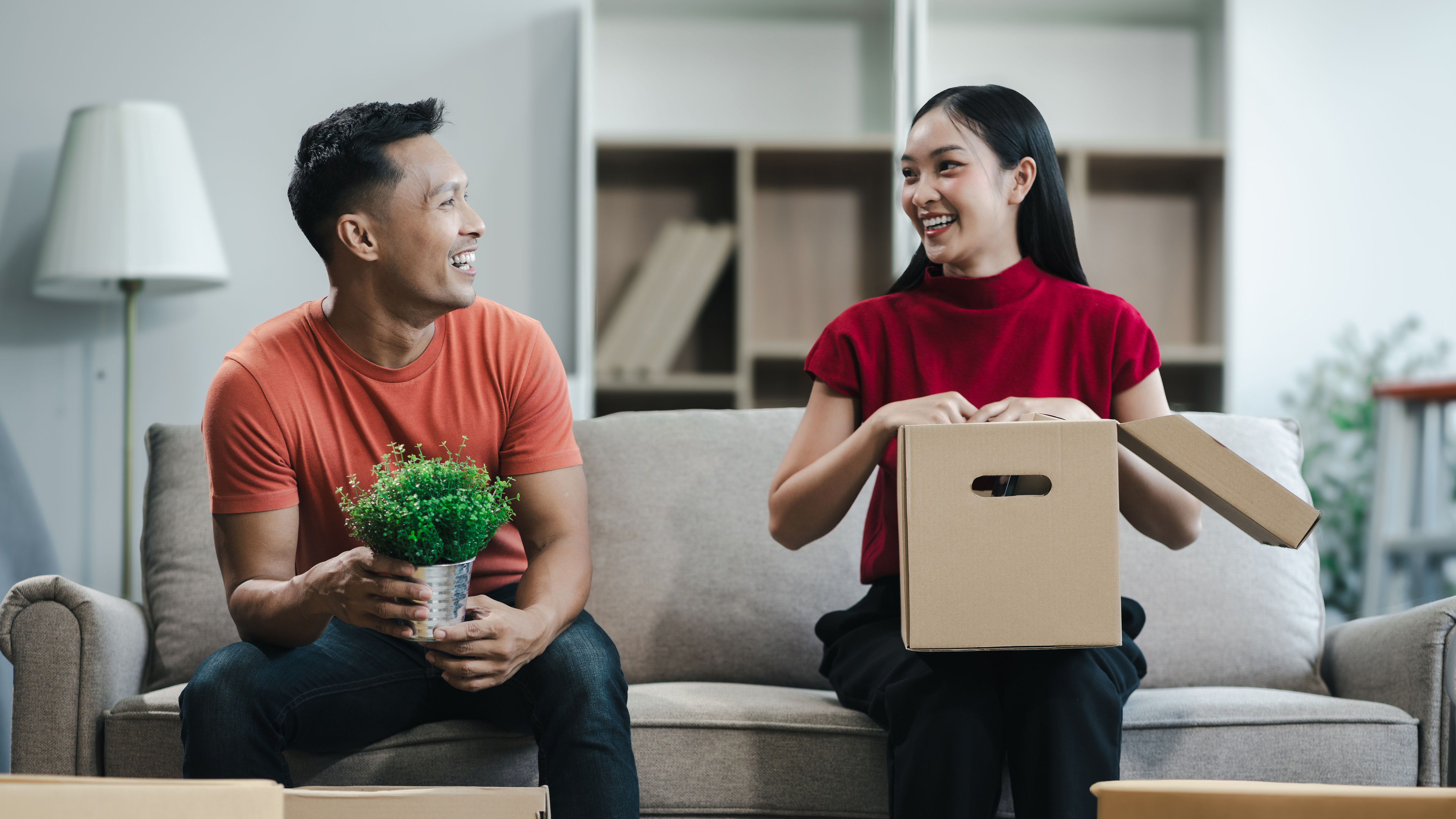 A couple happily organises their home with simple, budget-friendly improvements. 