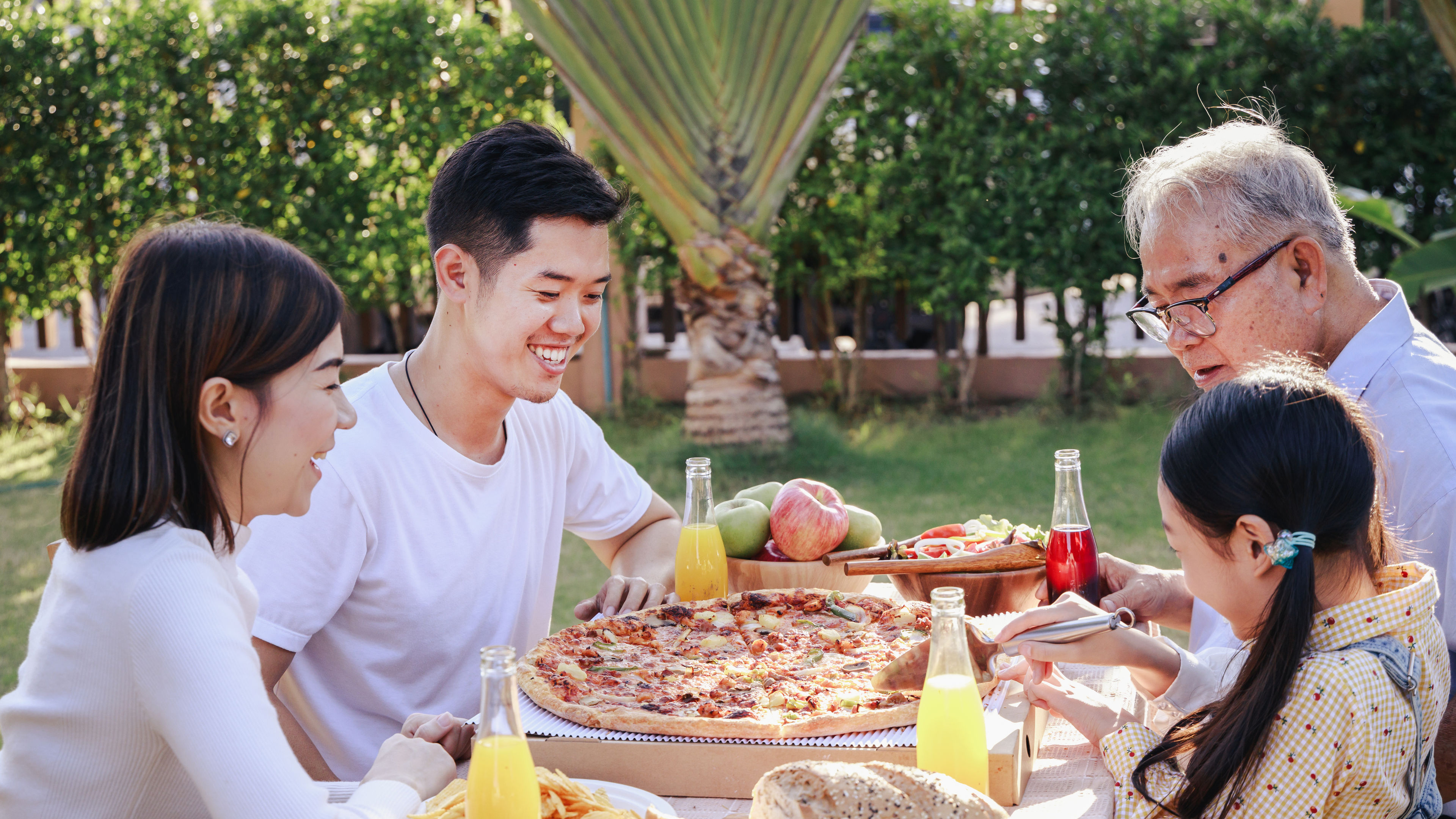 A family sharing their favourite pizza meal