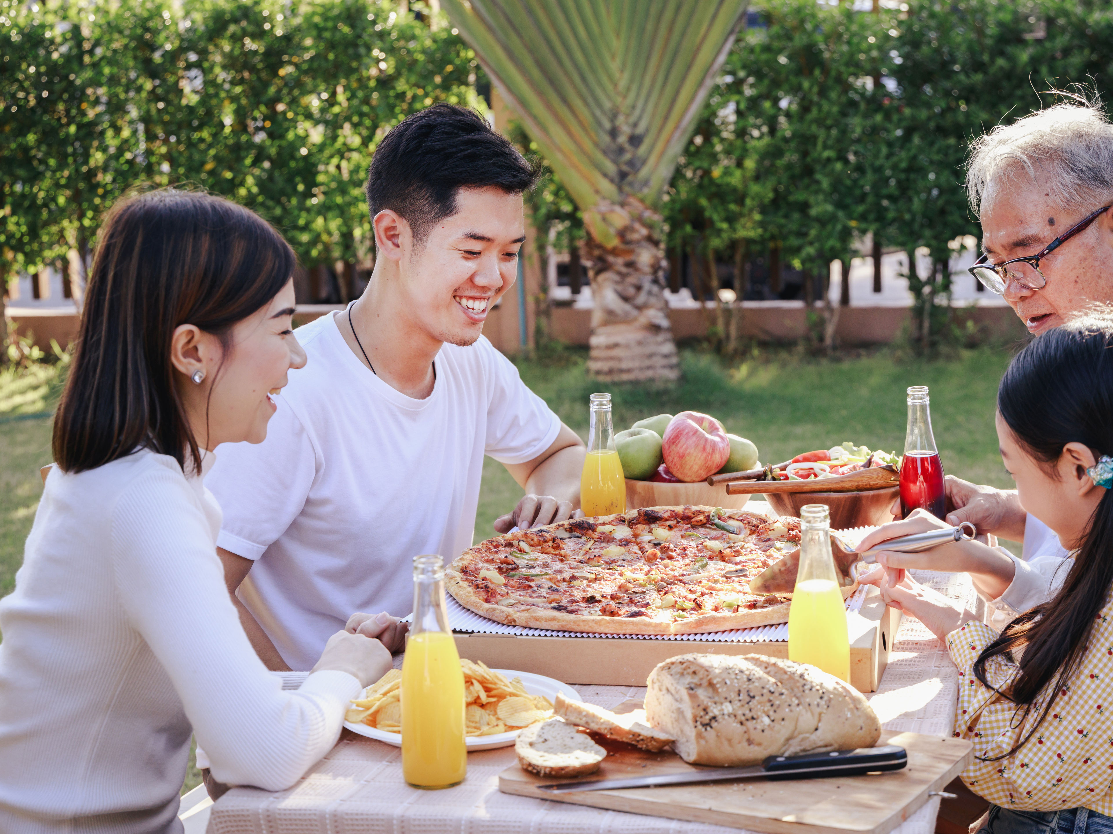 A family sharing their favourite pizza meal