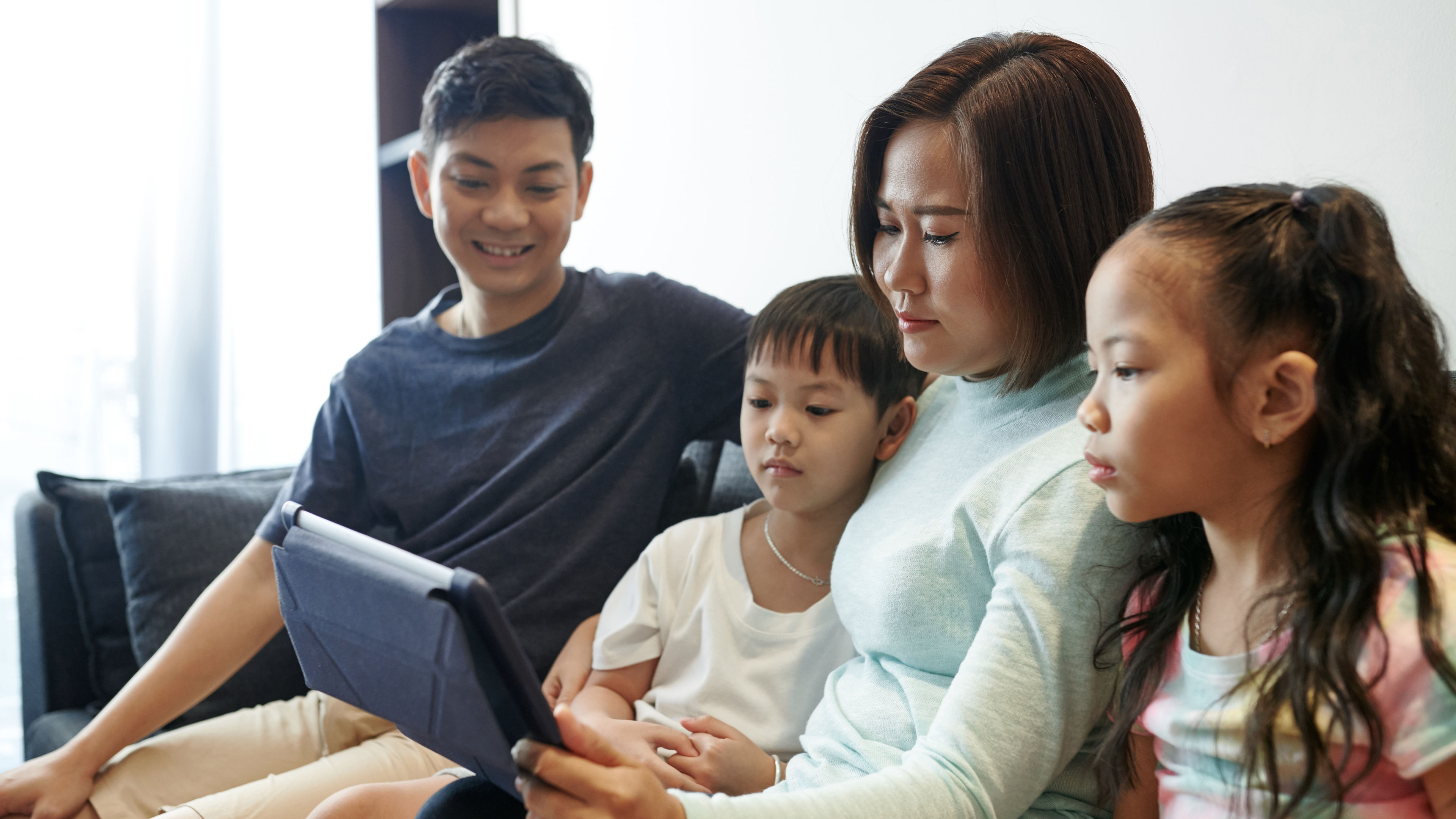 A family watching on tab