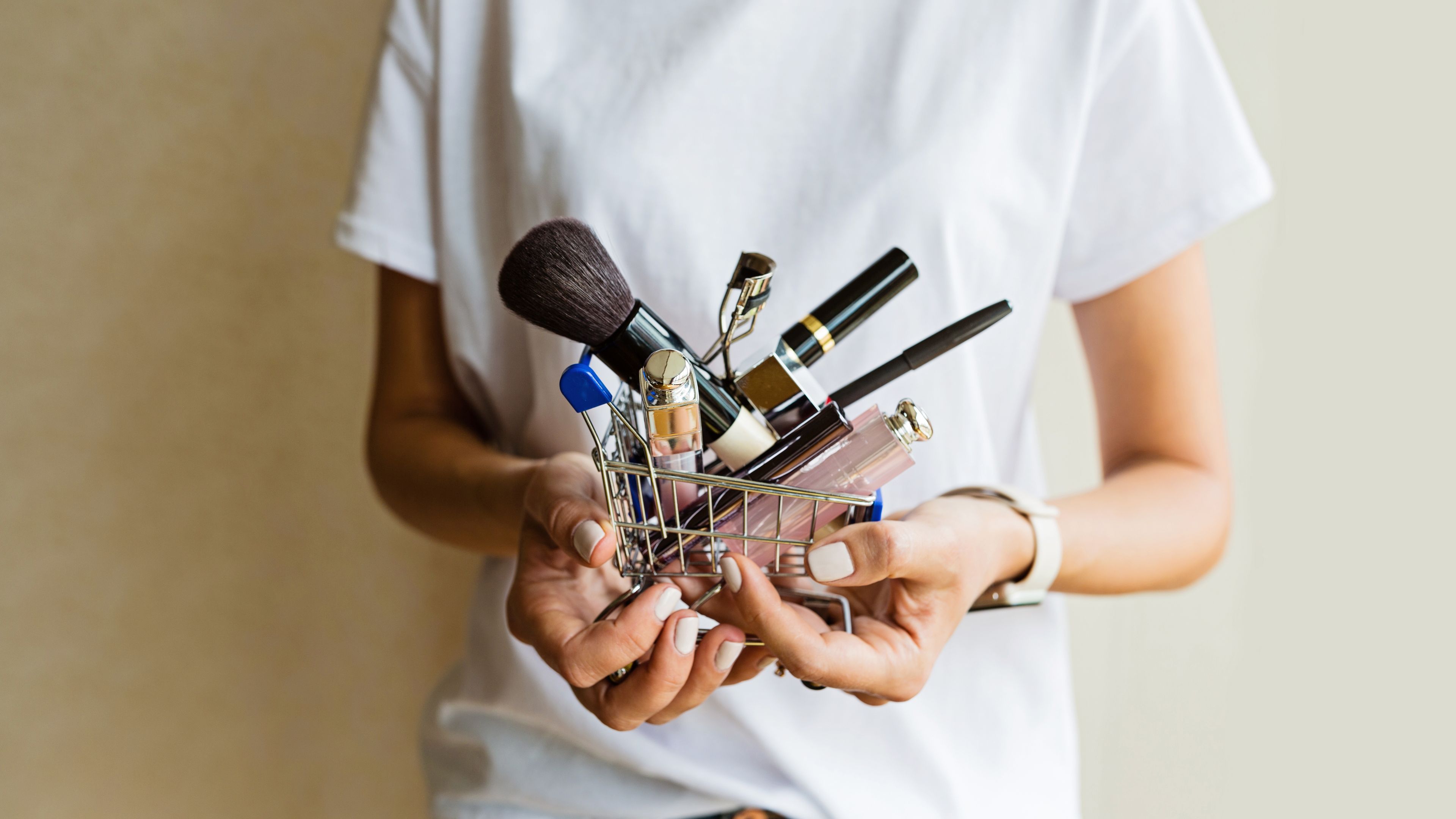 A shopping cart full of makeup products