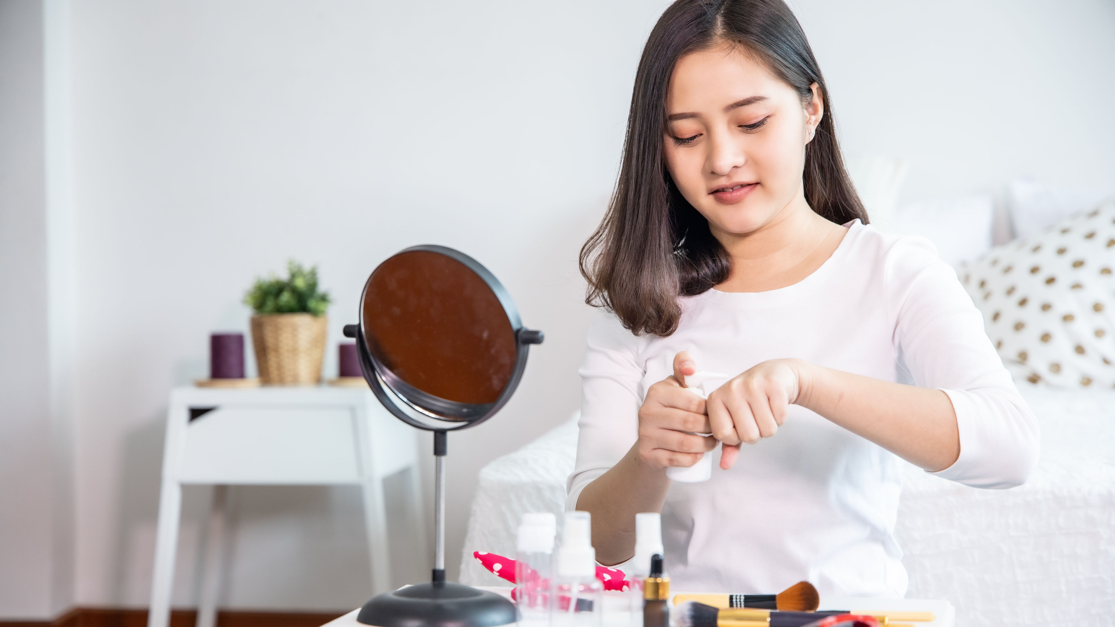 A woman testing makeup products 