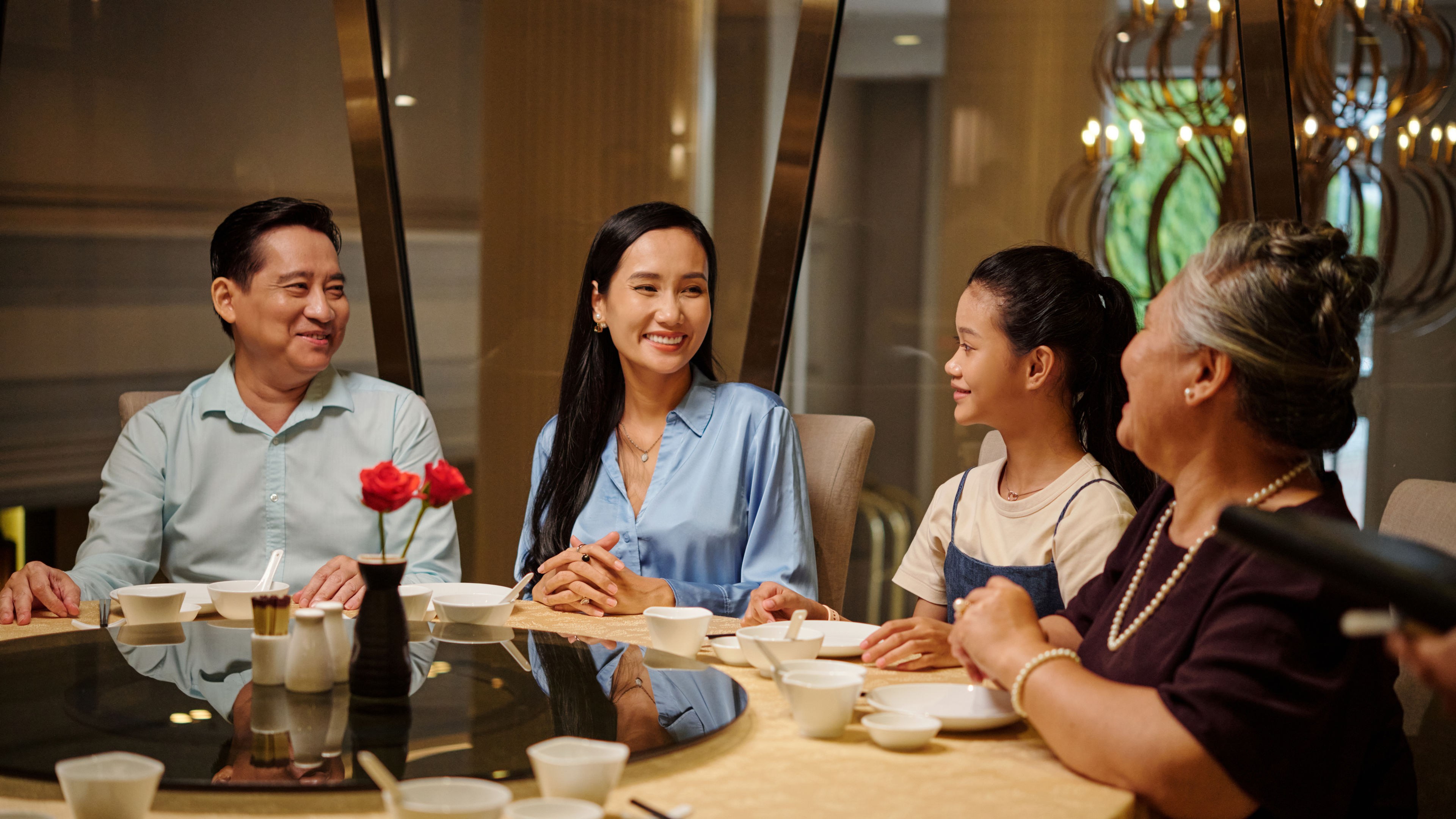 Family gathering together in the restaurant. 