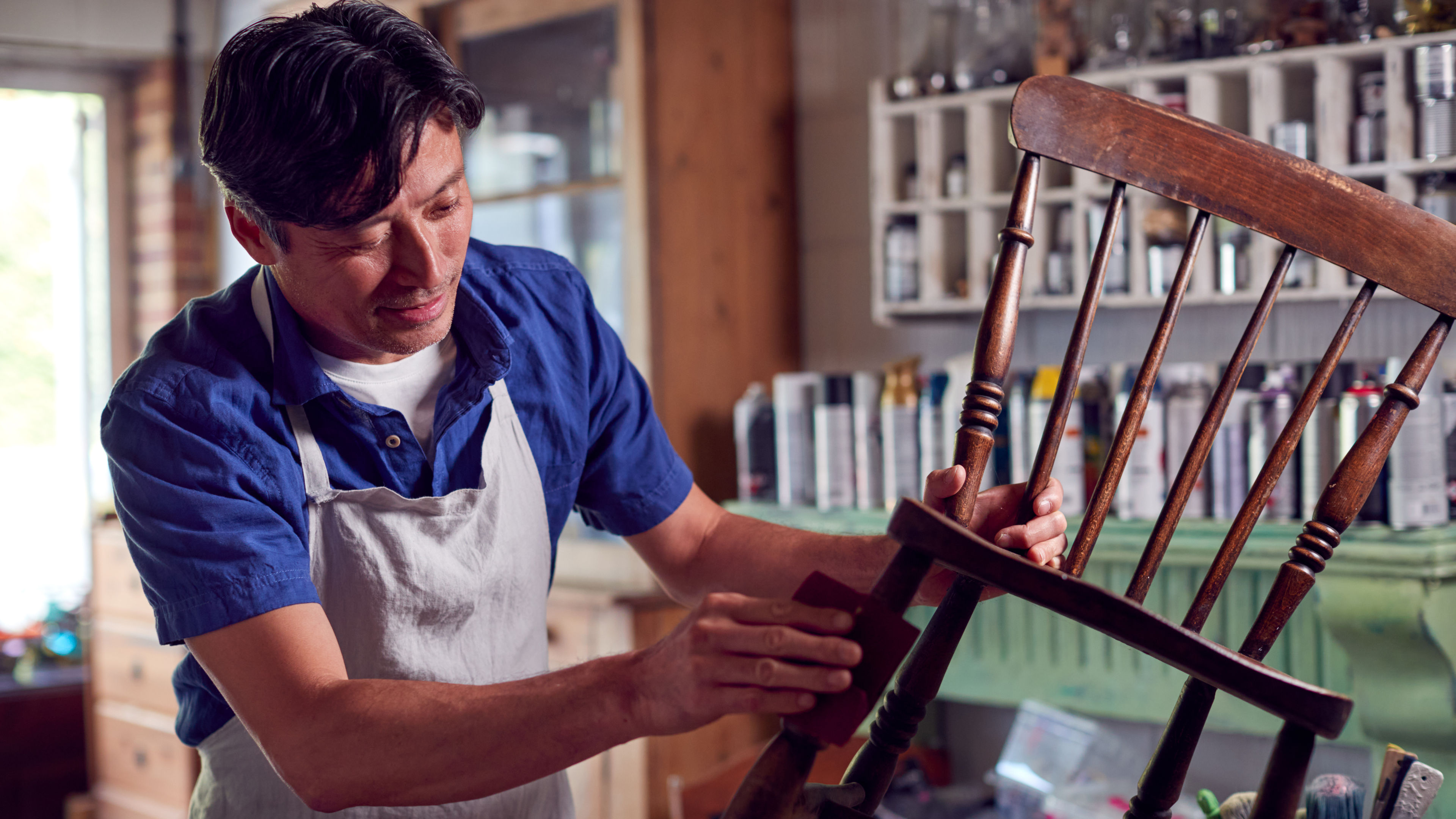 Man restoring furniture 