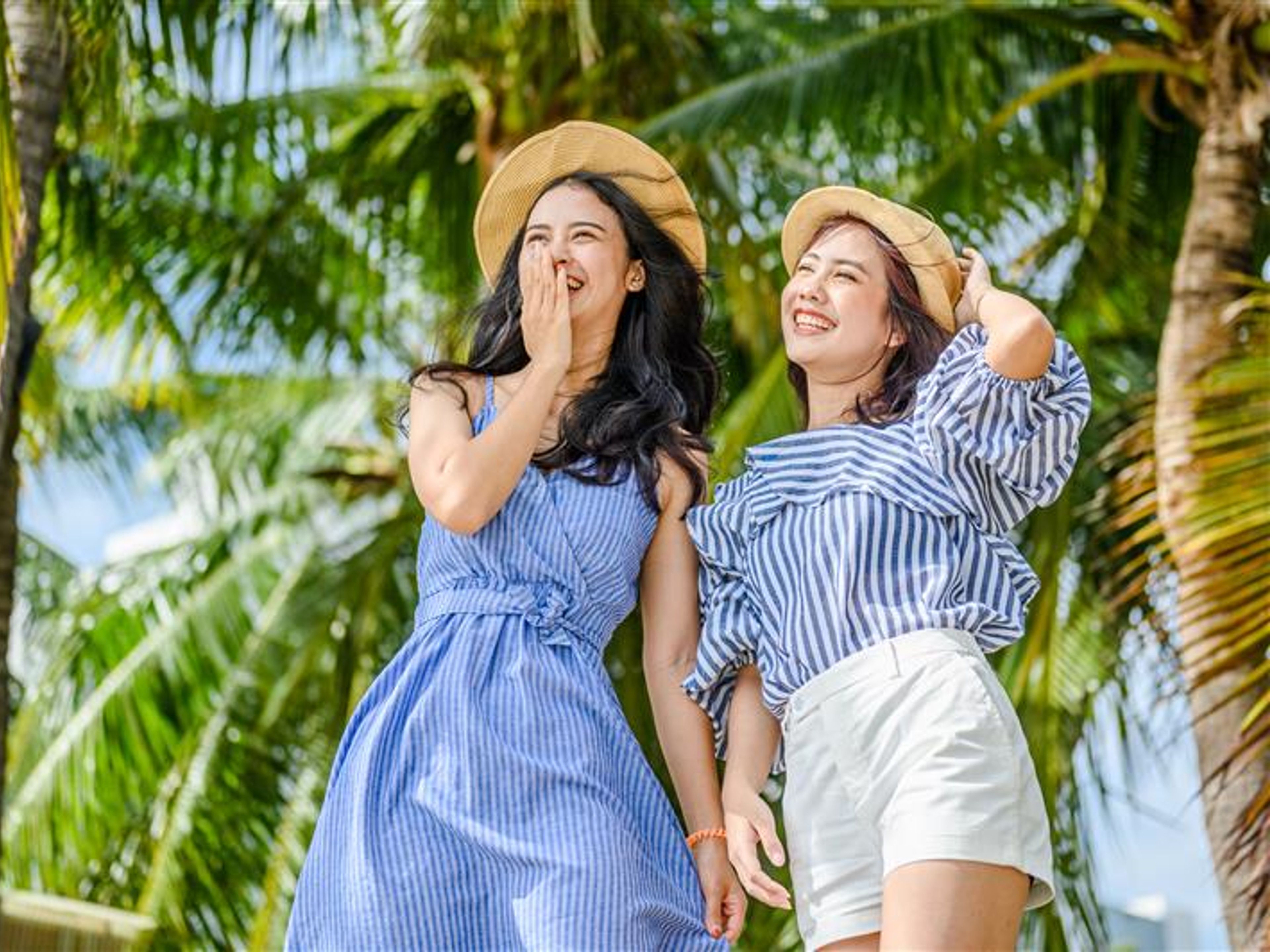 Women wearing hat at the beach