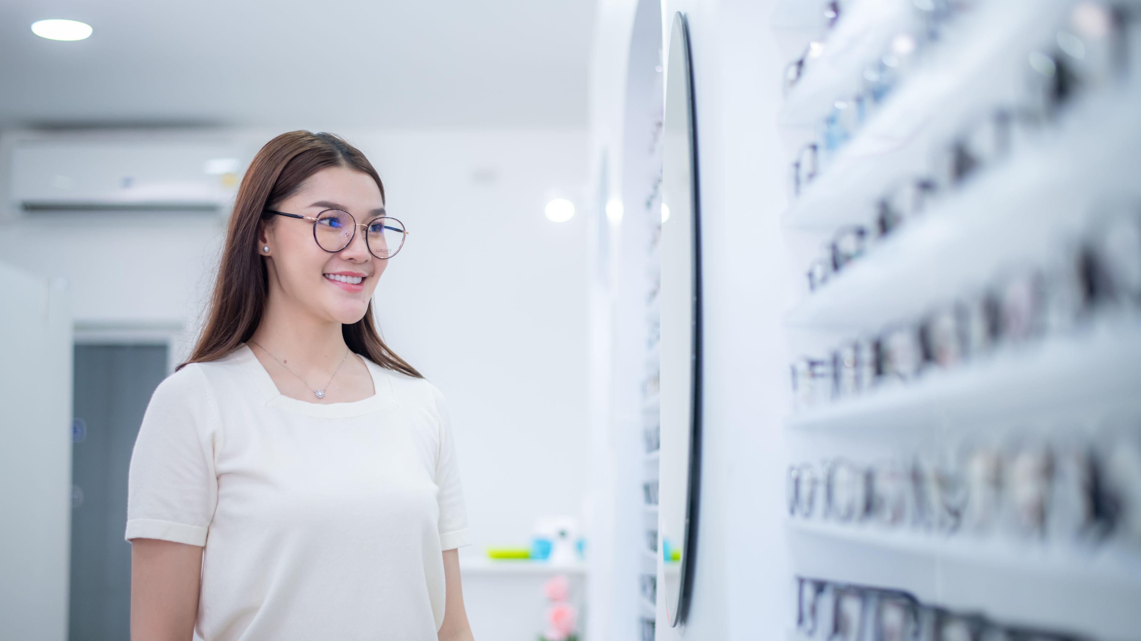 Asian girl in eyewear shop