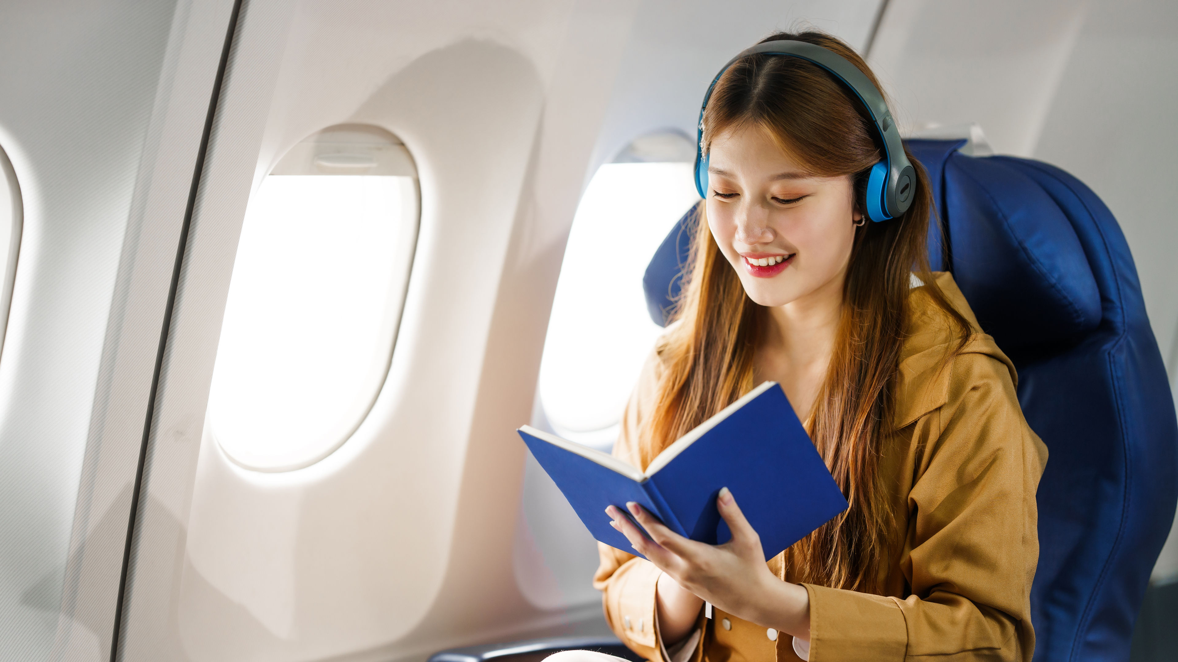 A young Asian women on an airplane