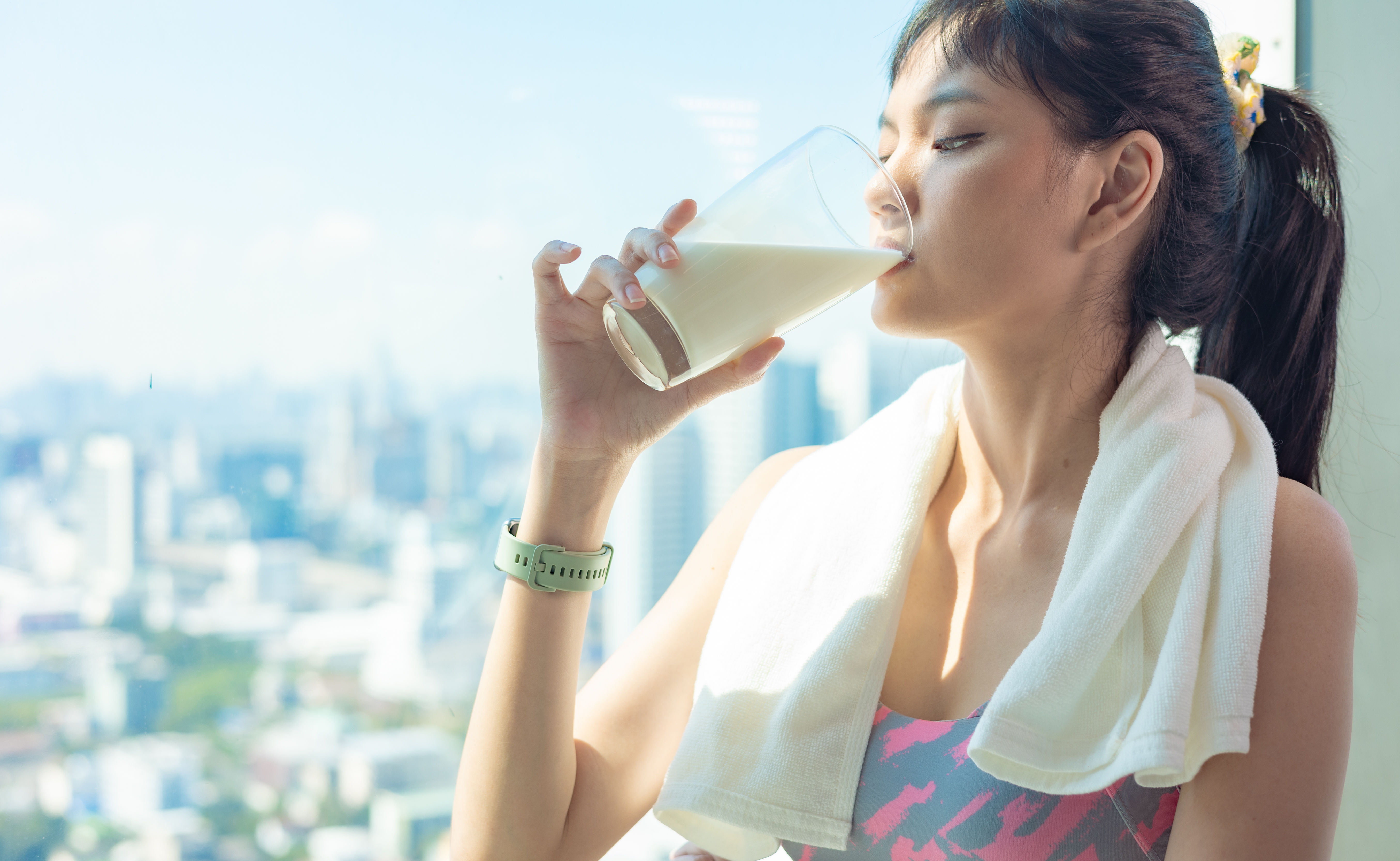 
A fitness woman drinking a protein shake