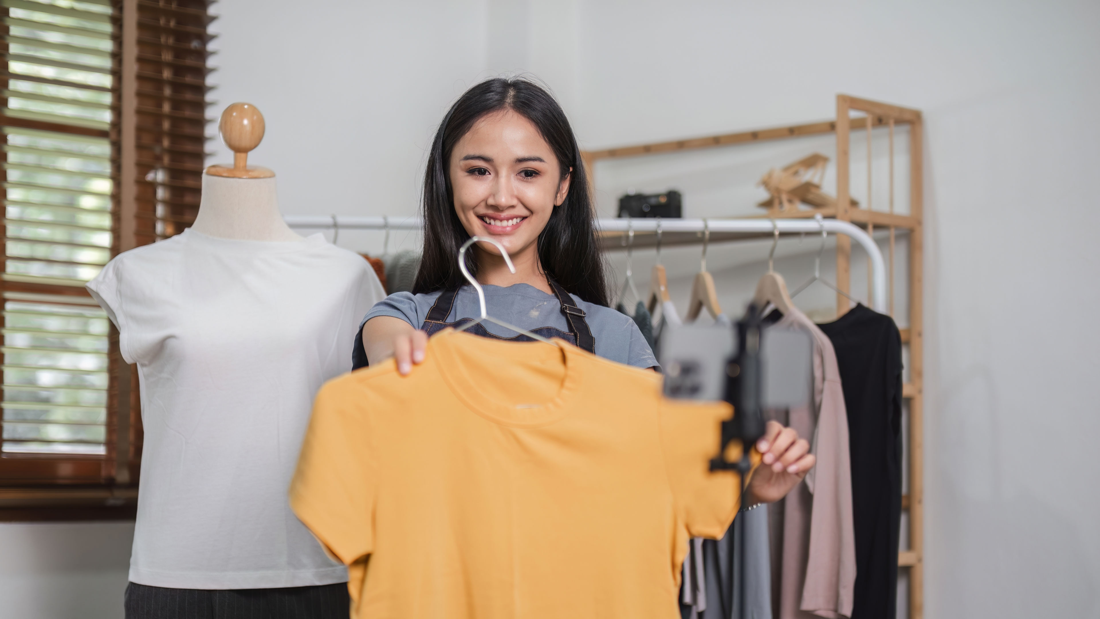 Asian Girl Selecting Dress
