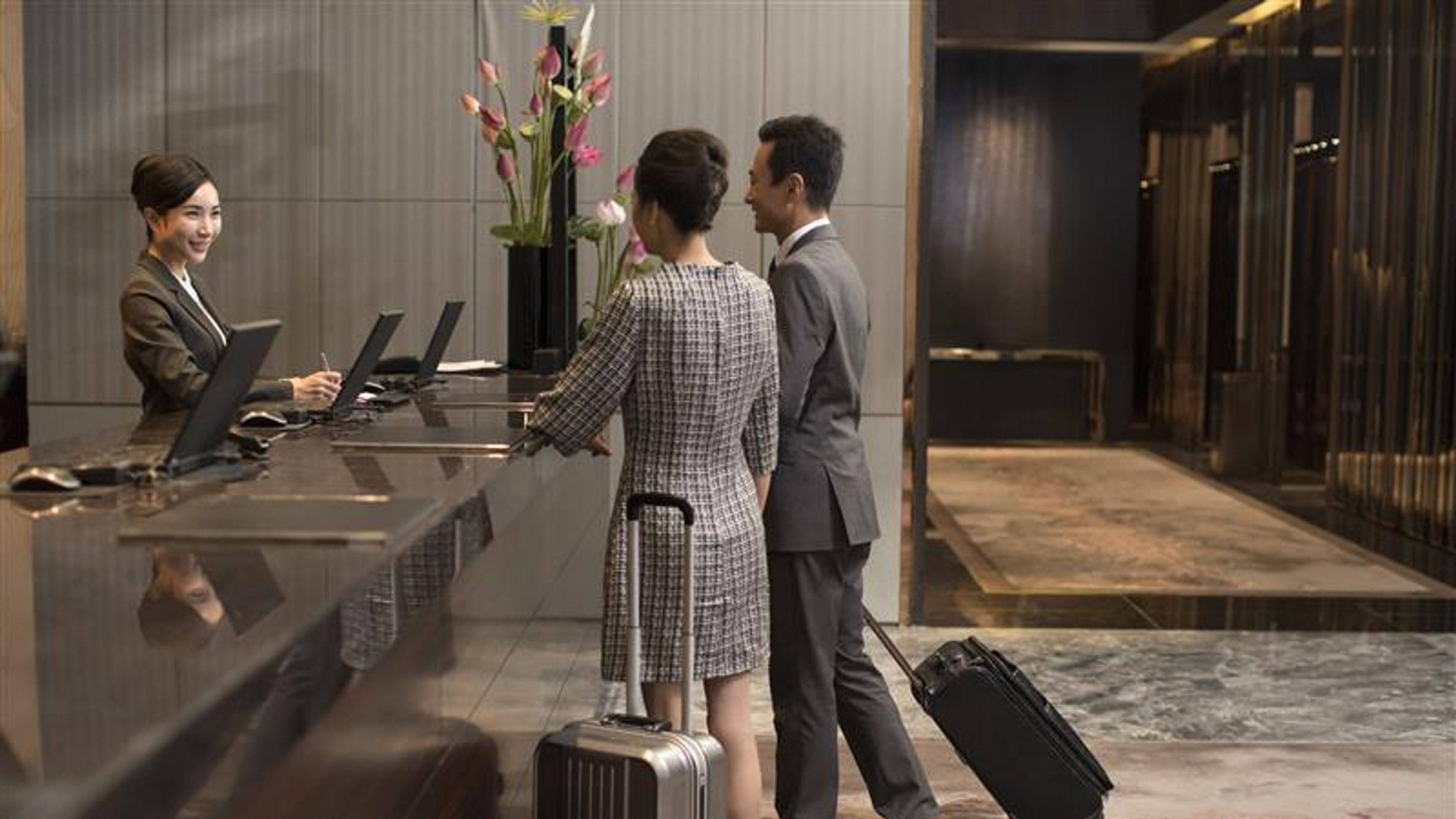 Couple booking at hotel 