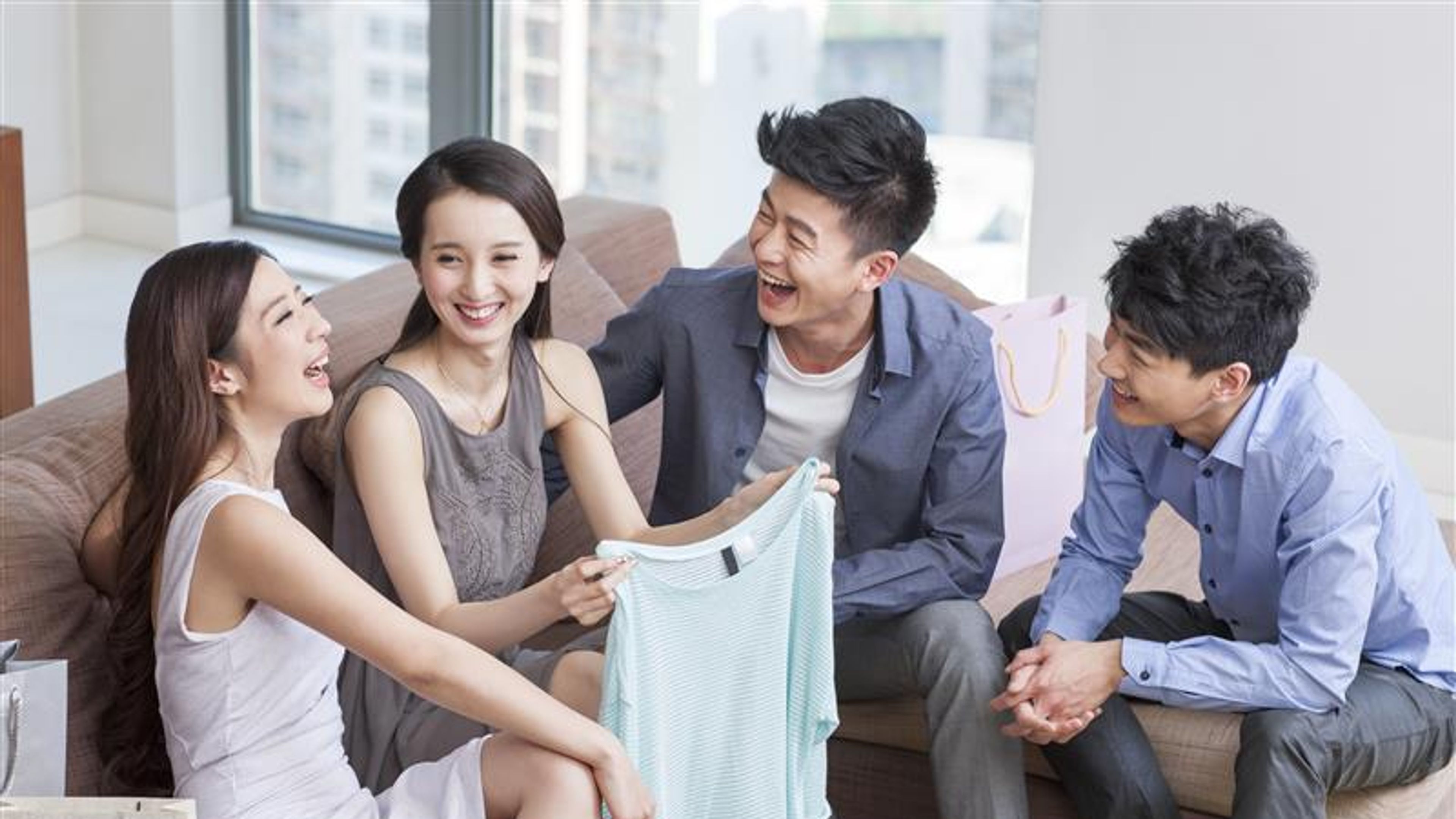 Friends looking at new clothes.
