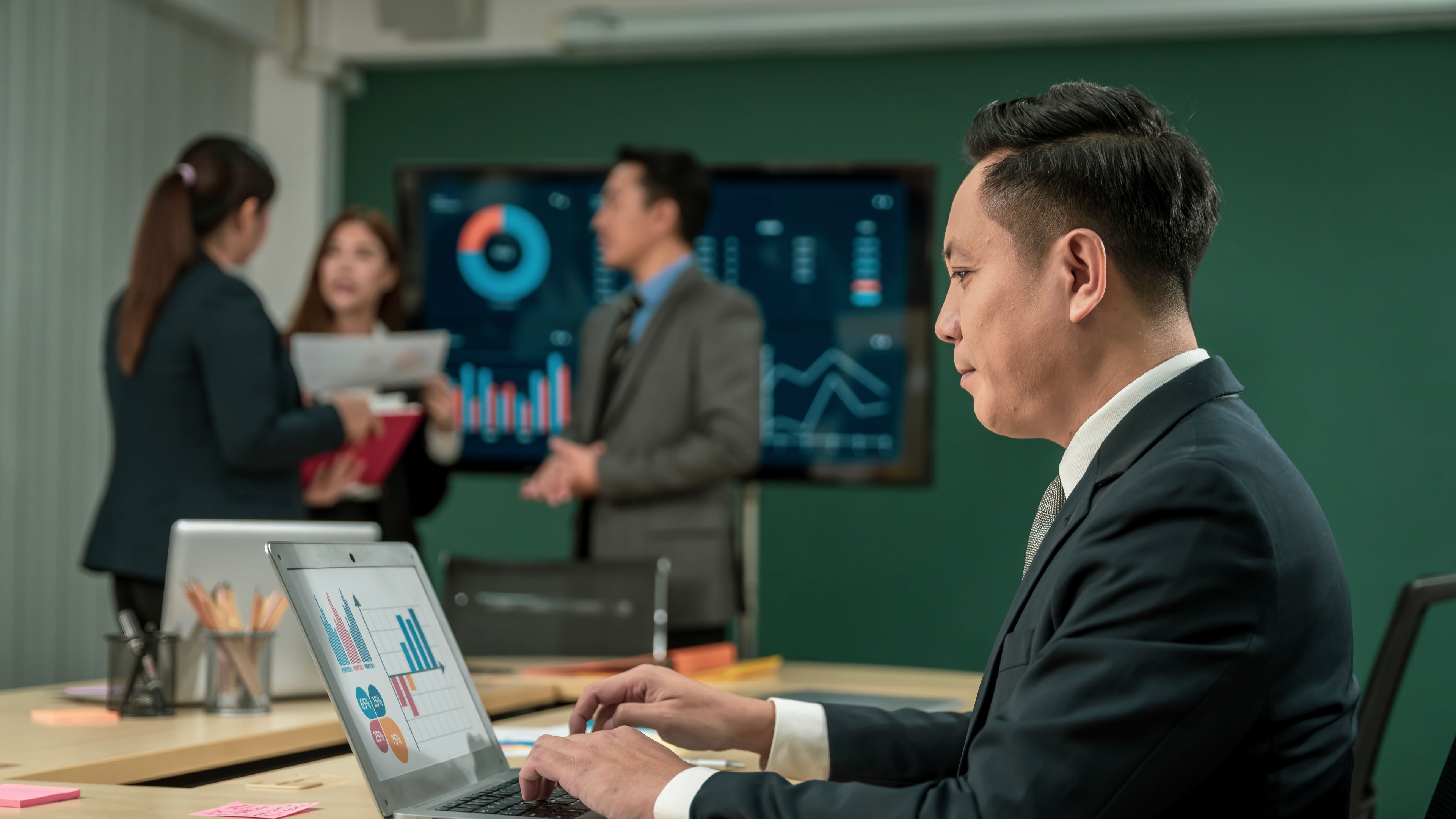 Modern Asian businessman with high confidence committed to working together