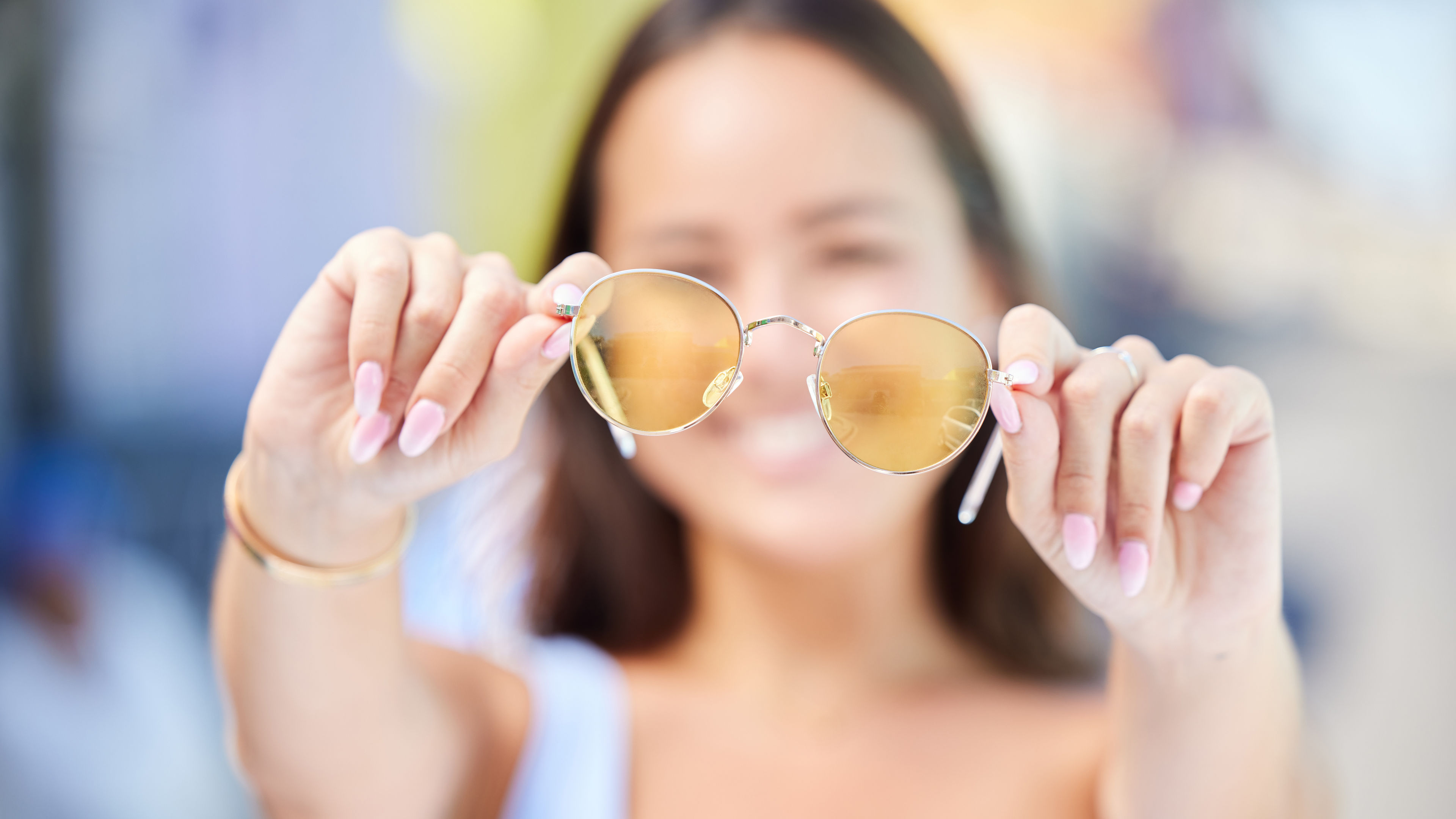 Summer, style and sunglasses in hands of woman for fashion and beauty. Sunshine, holiday and Asian .