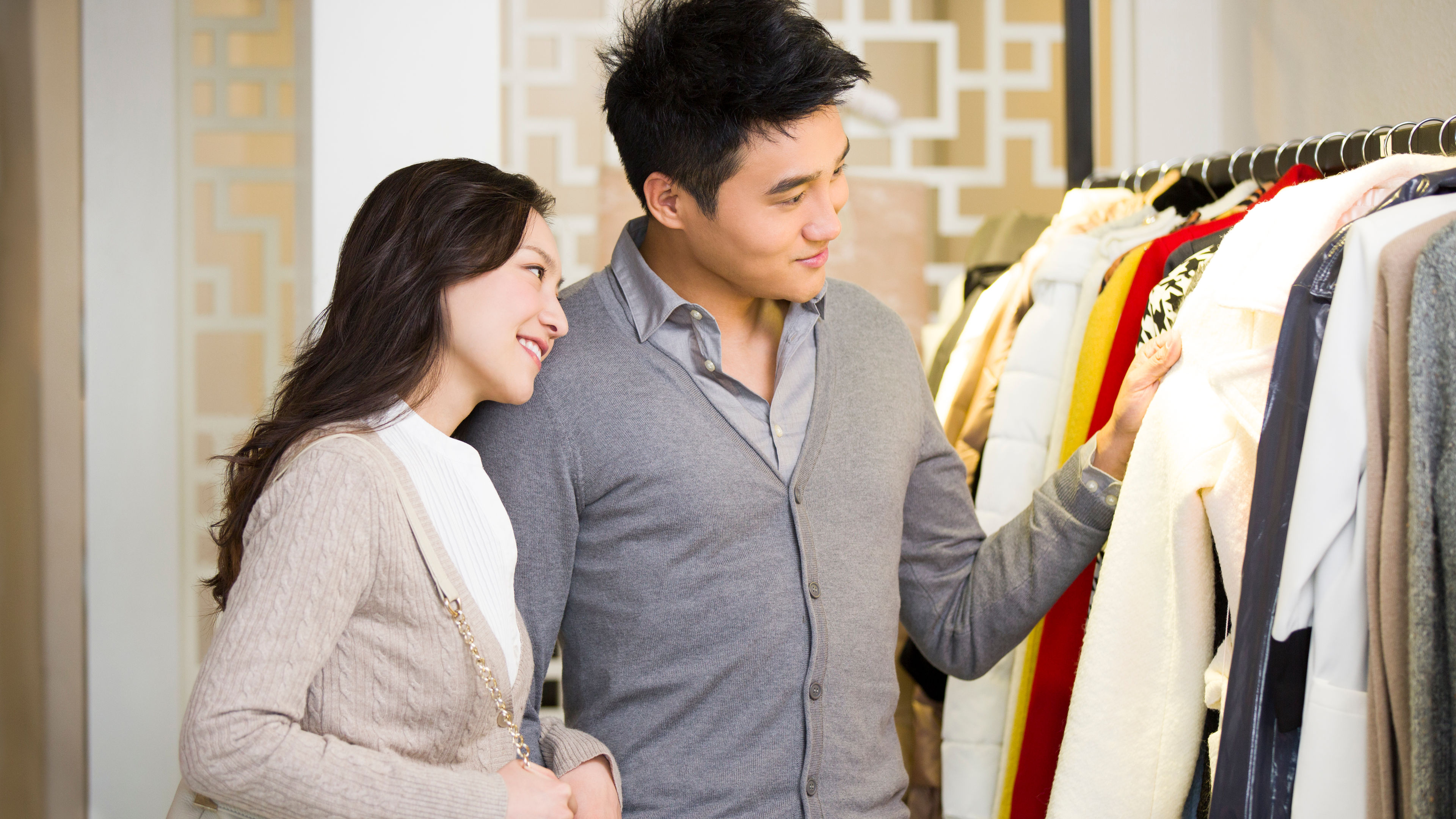 Young couple shopping for clothes