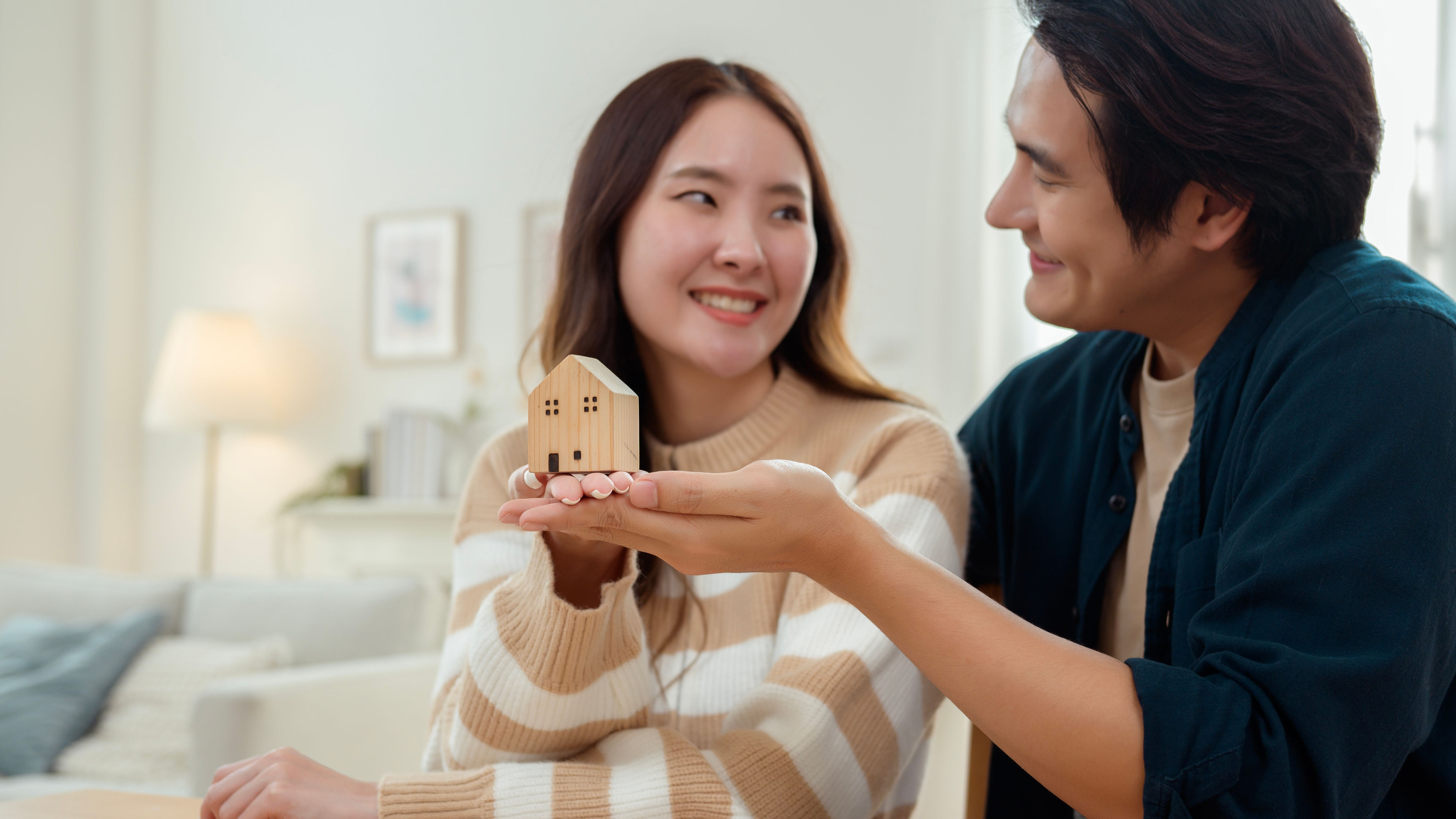 A couple is smiling at each other