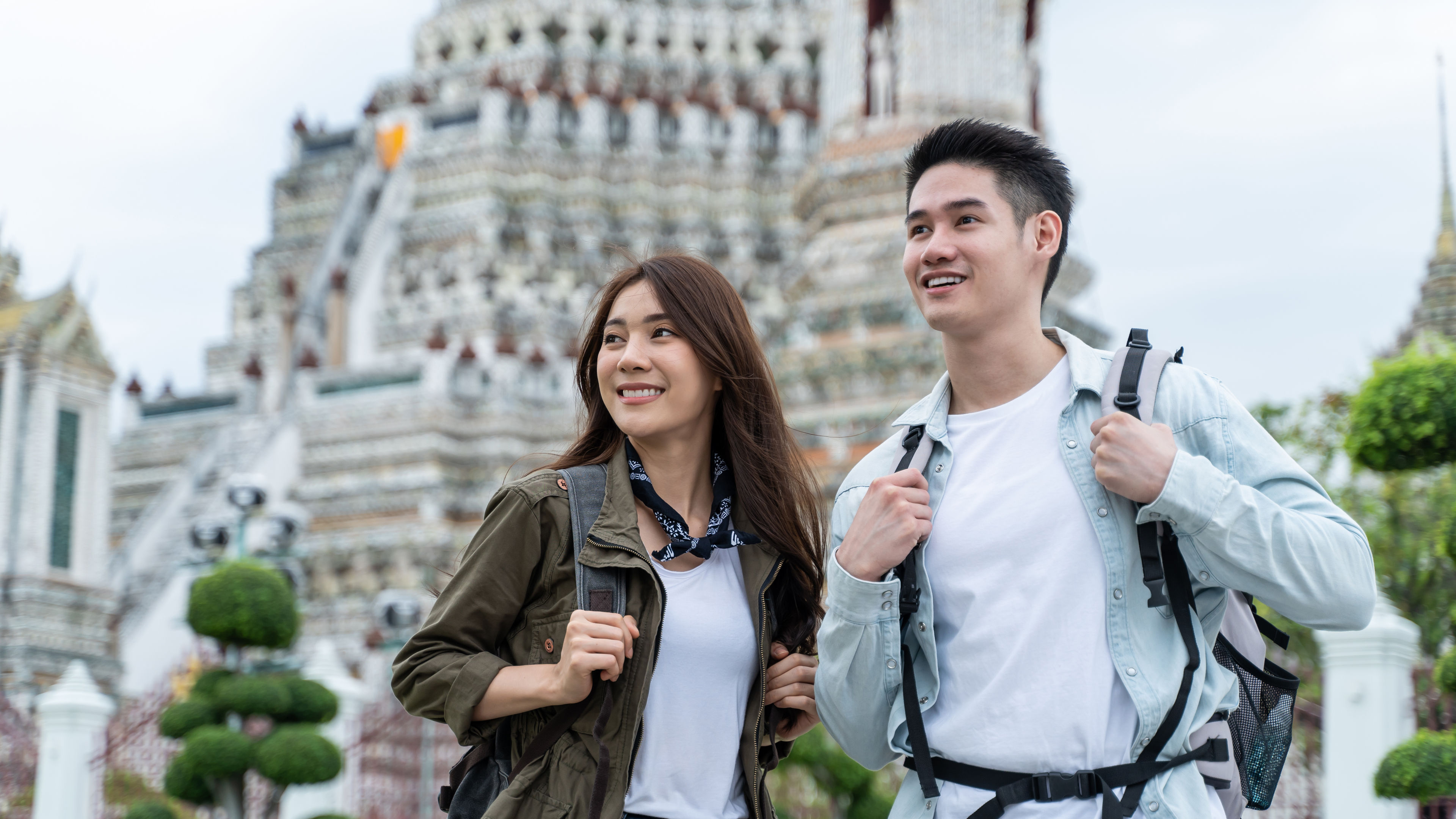 Asian attractive romantic couple travel in the city for honeymoon trip