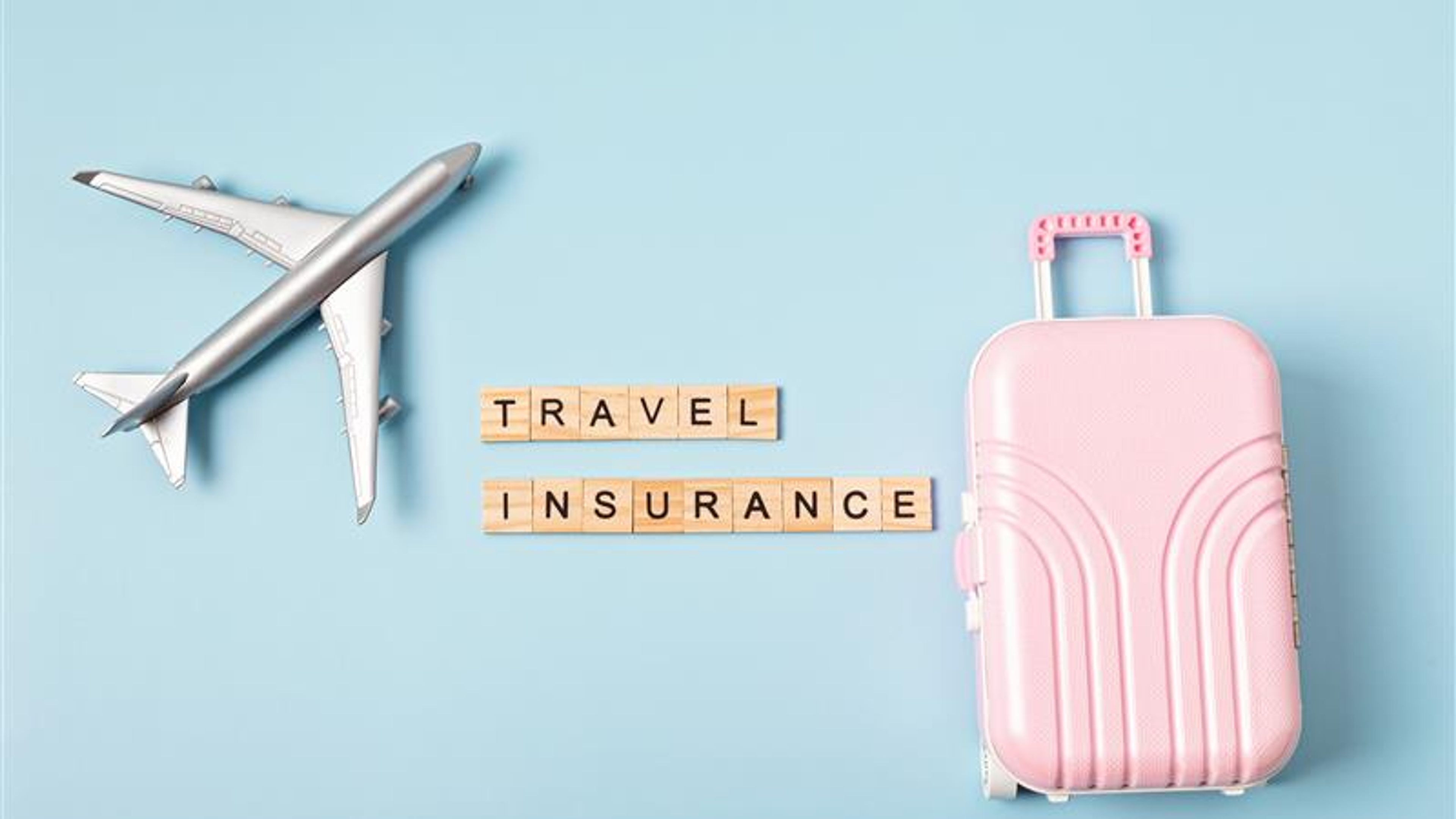 Image of a suitcase and aeroplane. 
