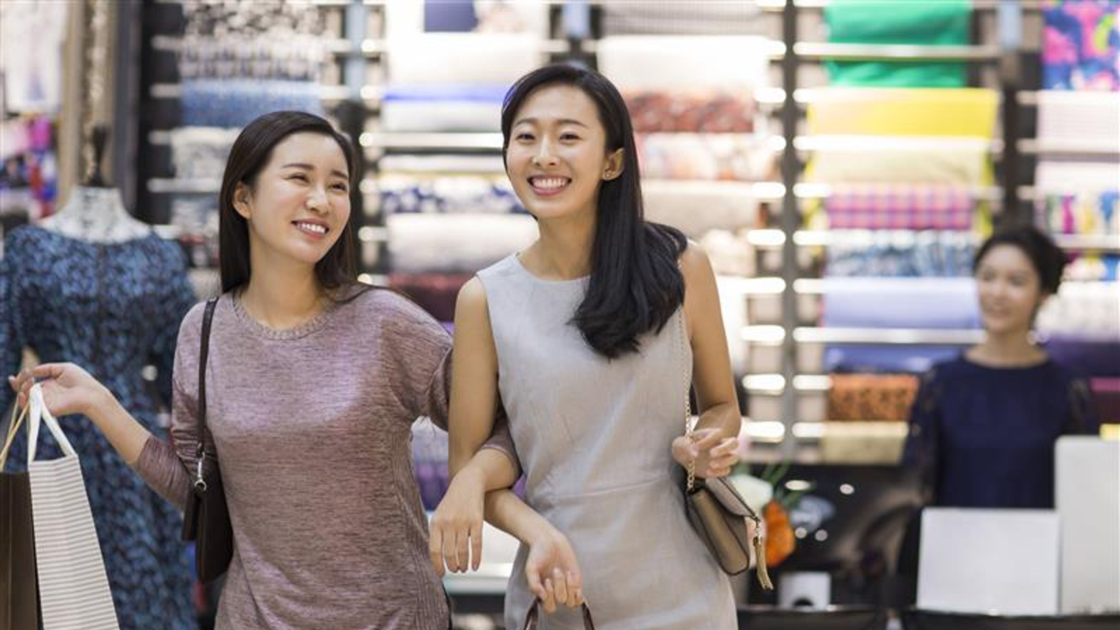 Two friends leaving after shopping