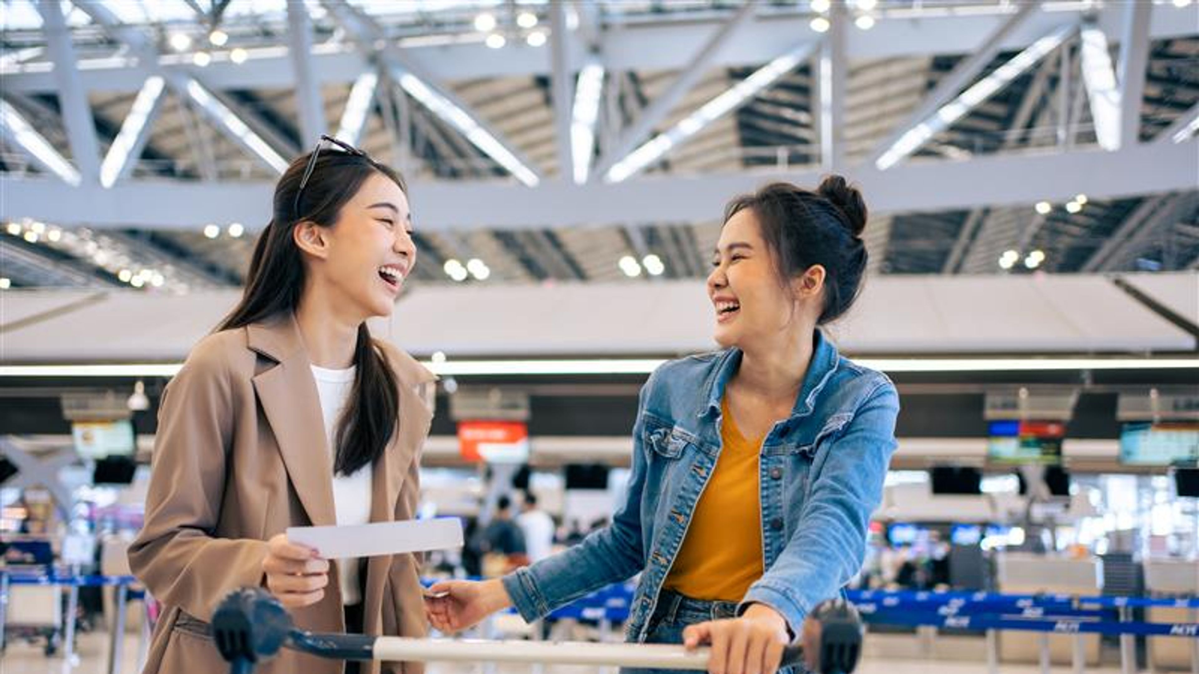 Two young women in an airport