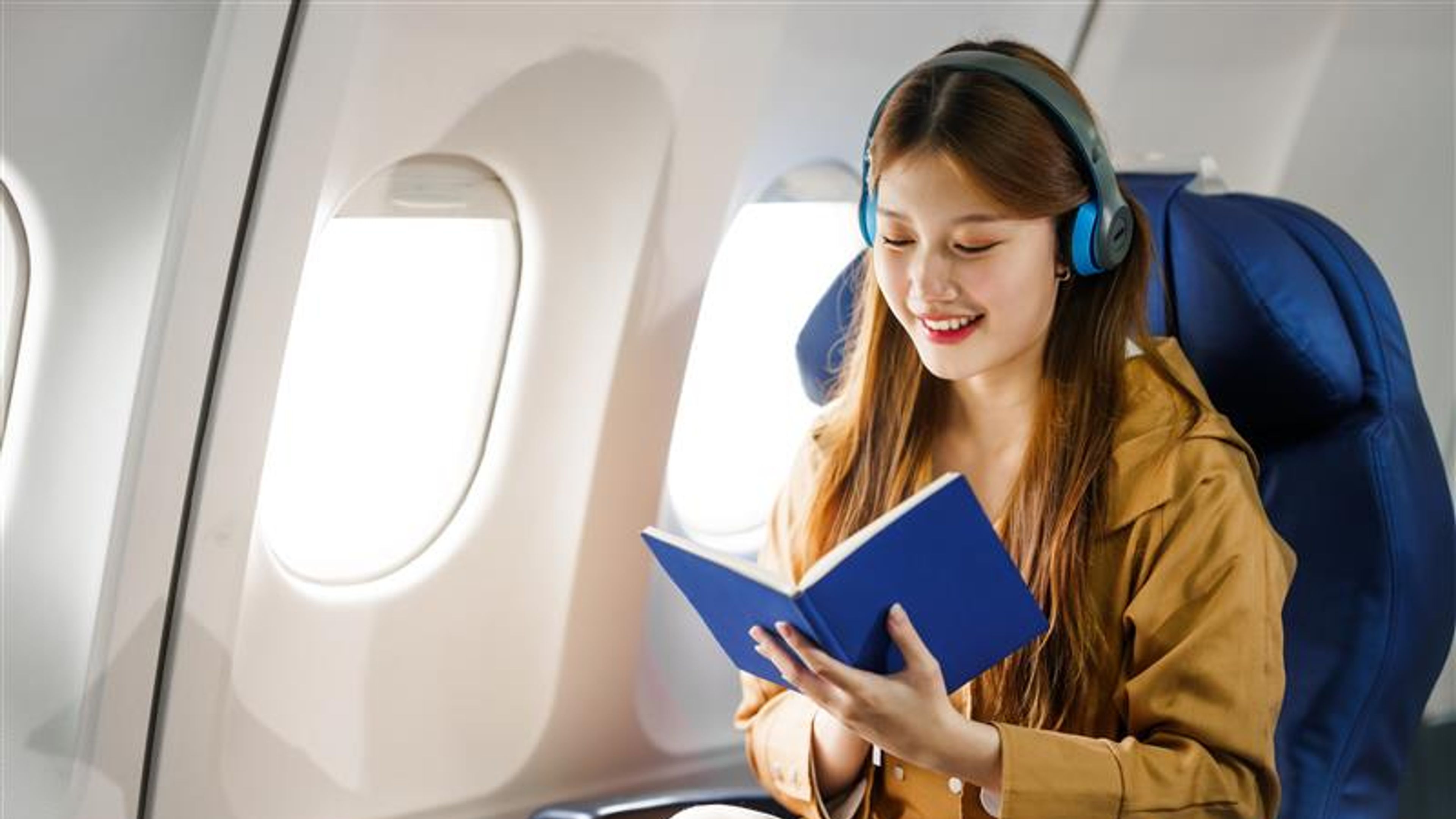 Young Asian woman in airplane