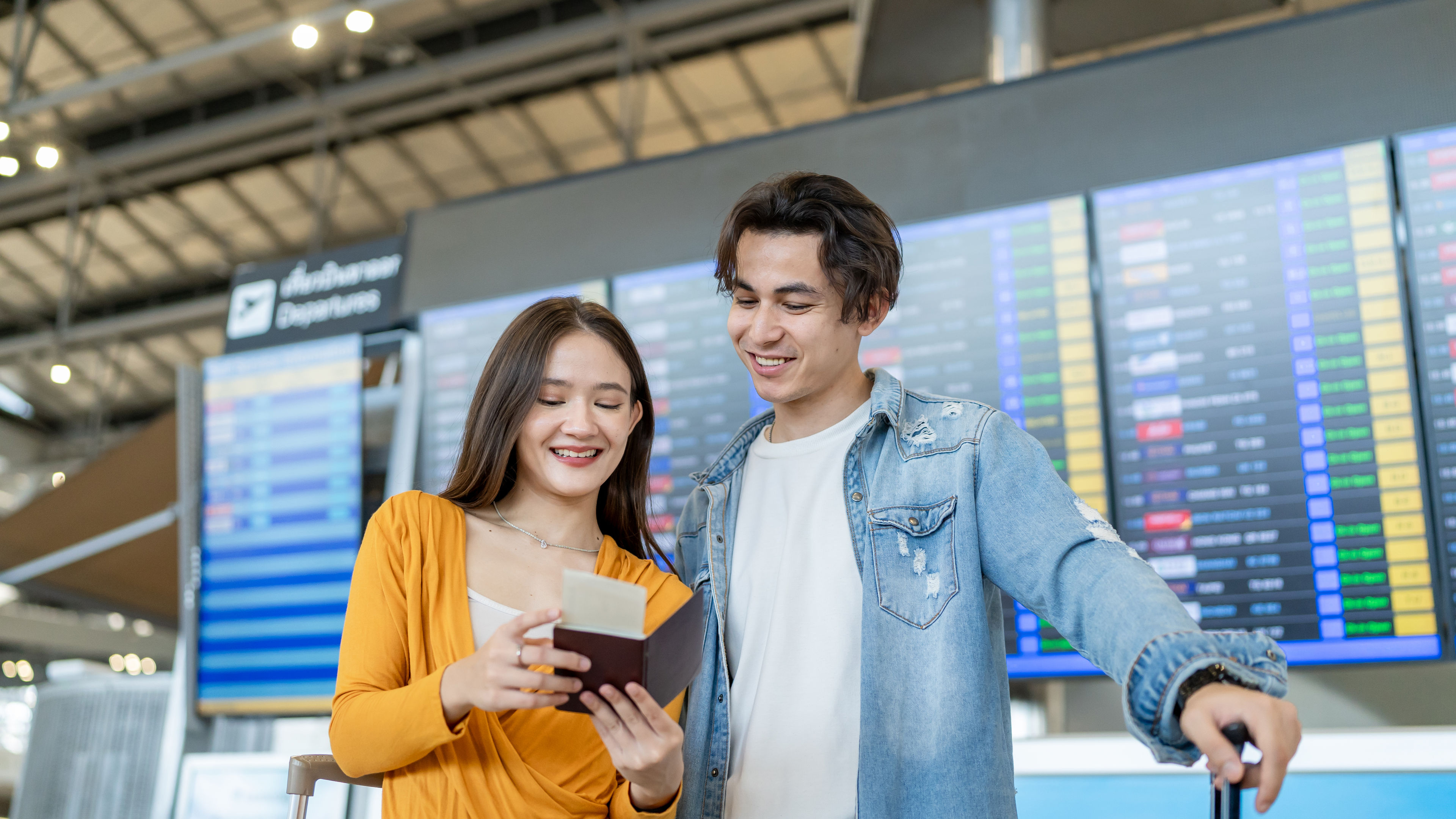 Asian passengers checking flight
