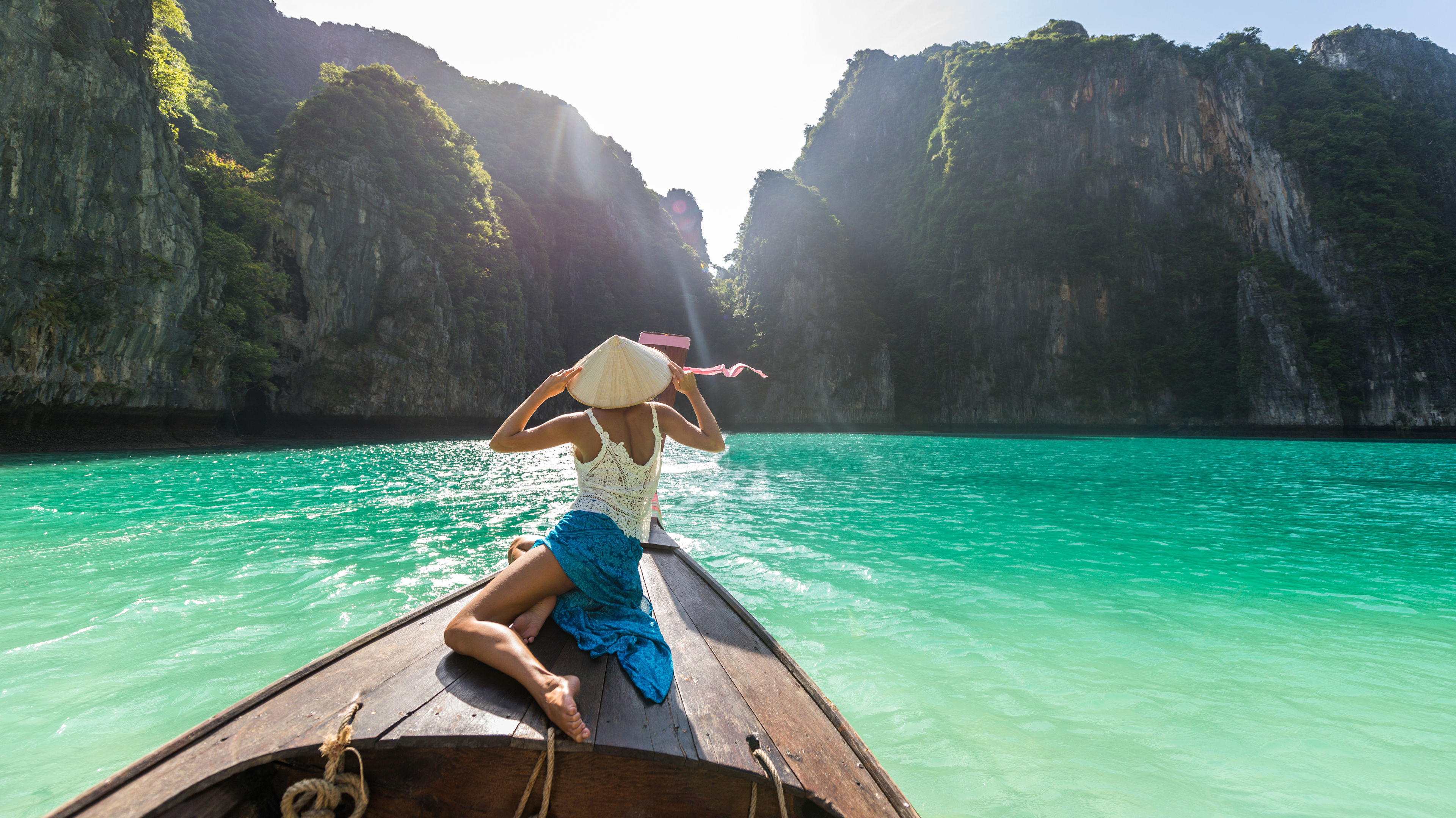 Beautiful woman on a long-tail boat in Thailand