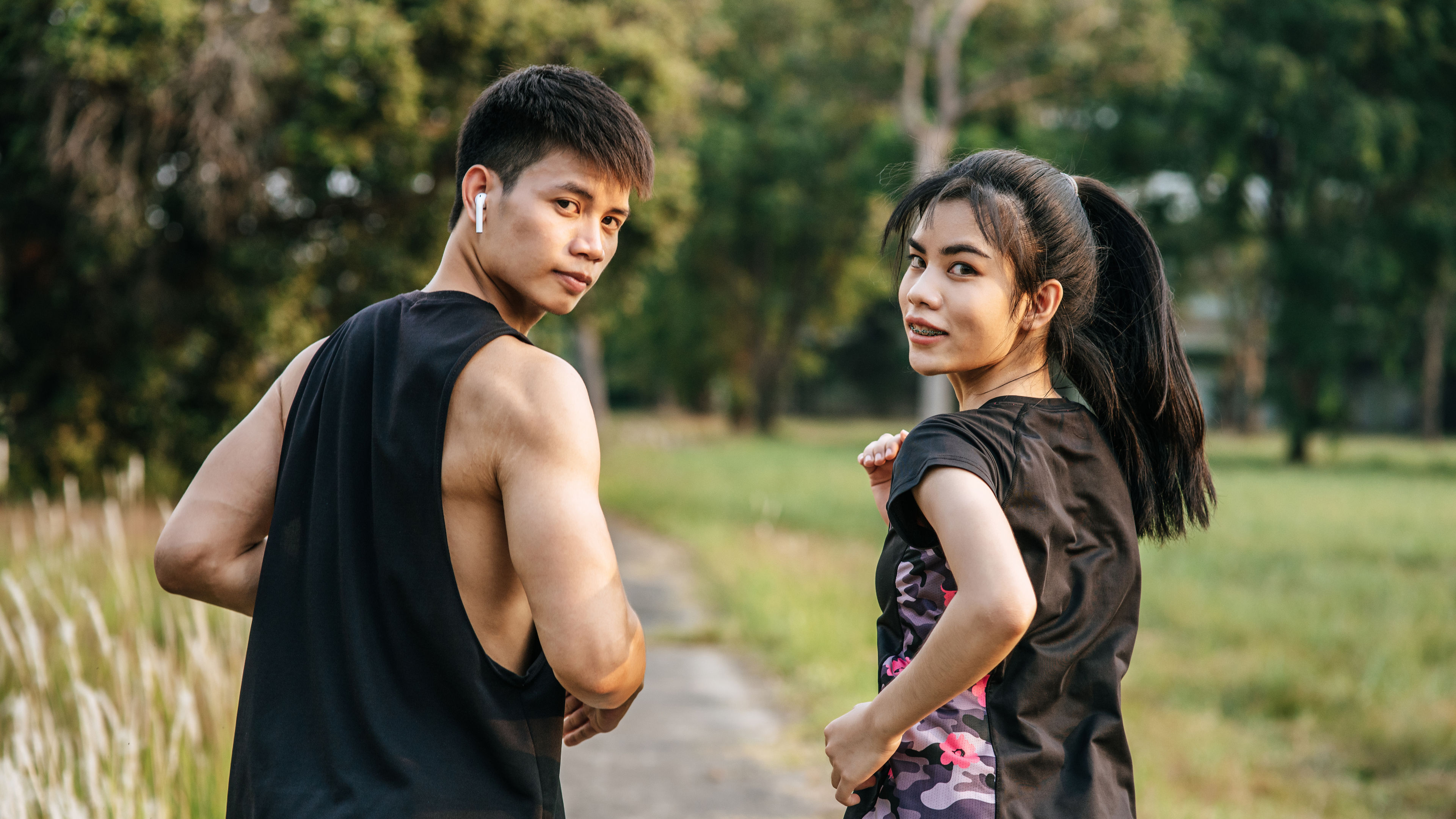 Man and woman in black sports dress