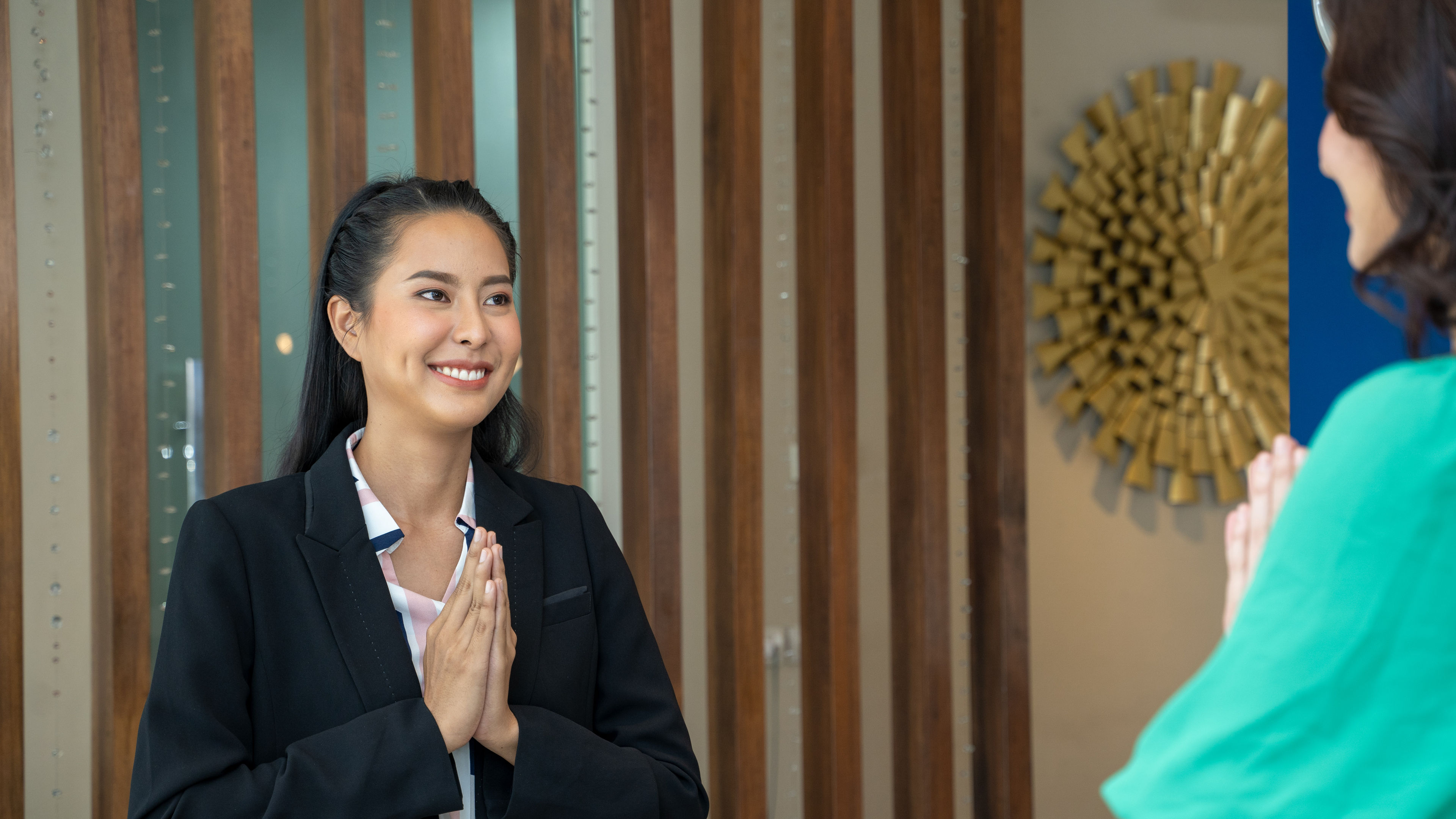 Receptionist welcoming guest