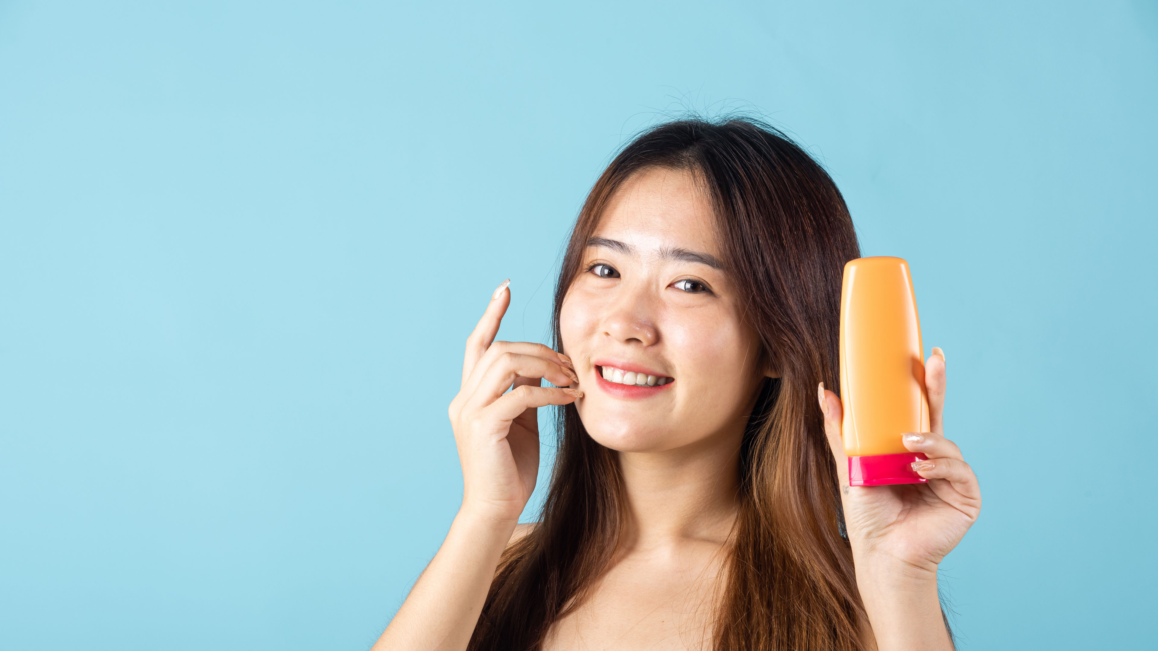 Smiling Young Woman with Skincare