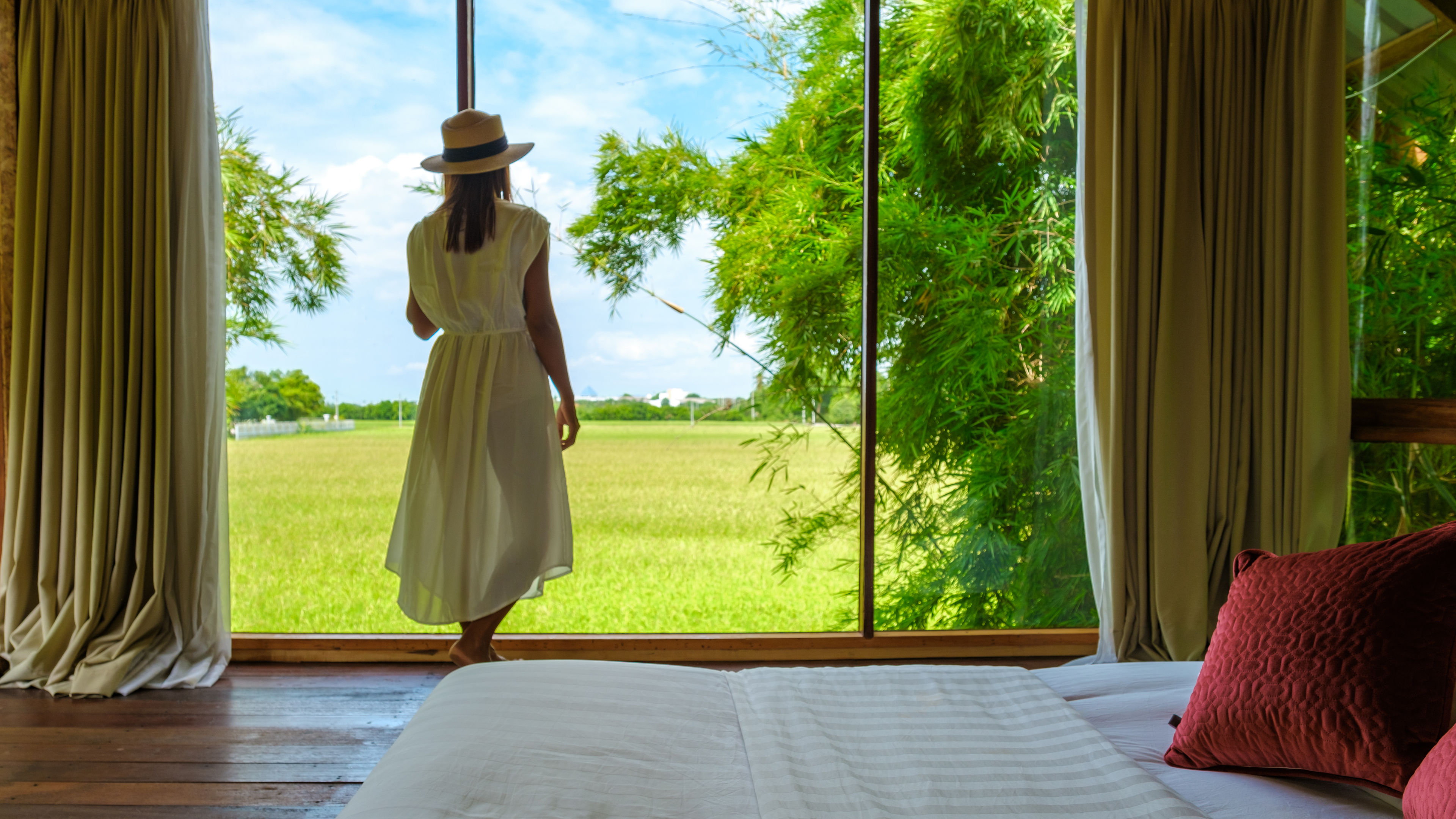 Asian women standing by the window