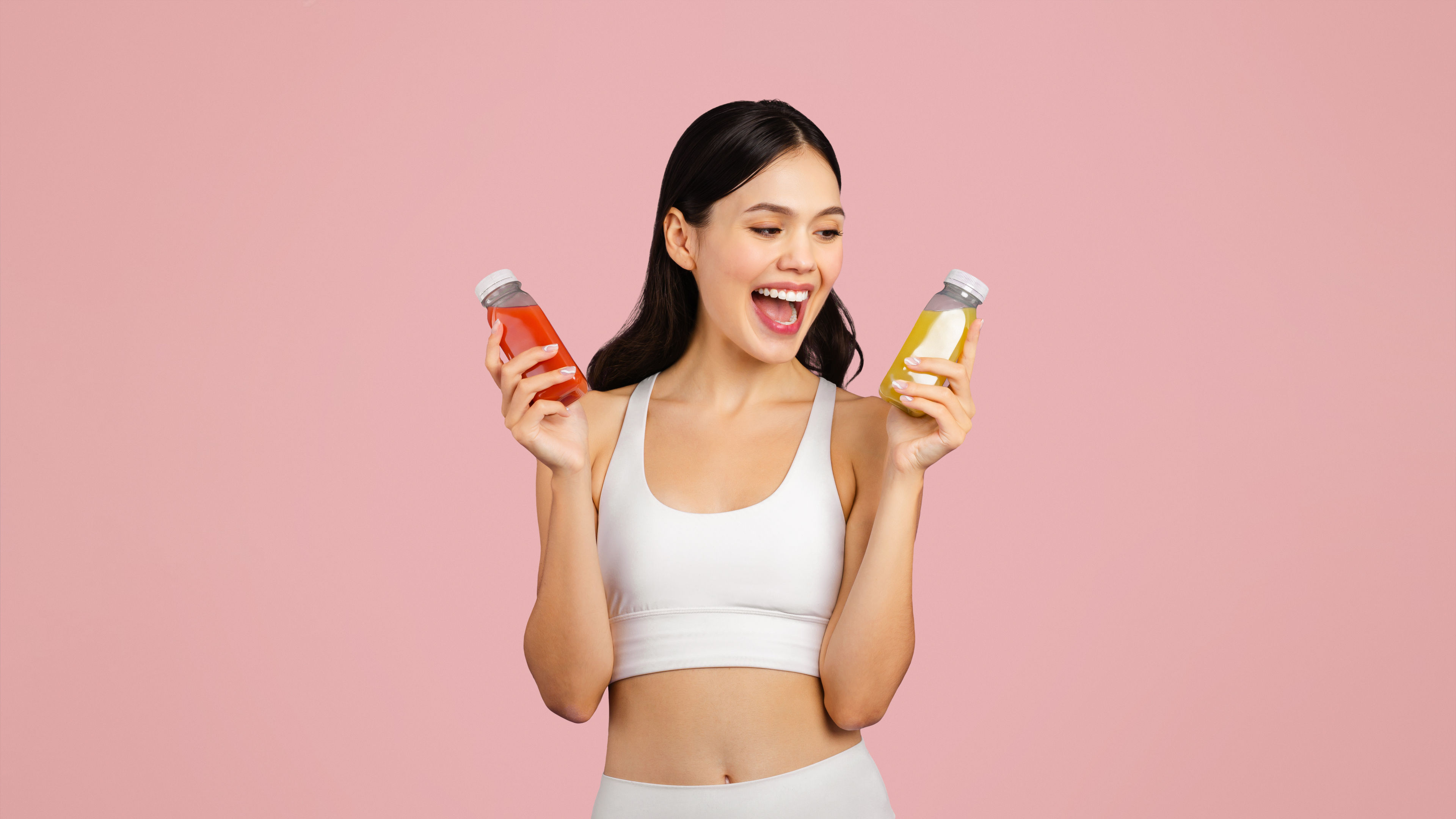 Happy Woman Holding Two Bottles