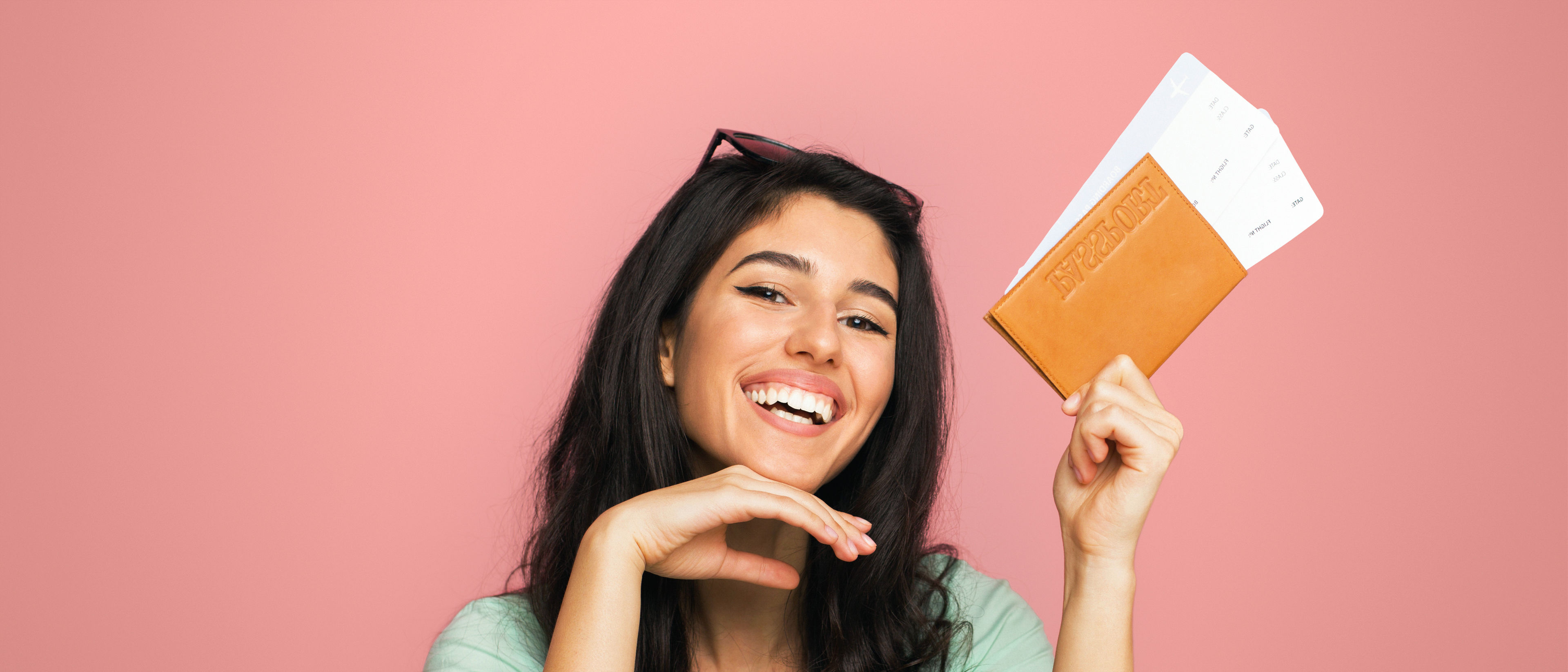 Excited woman holding passport