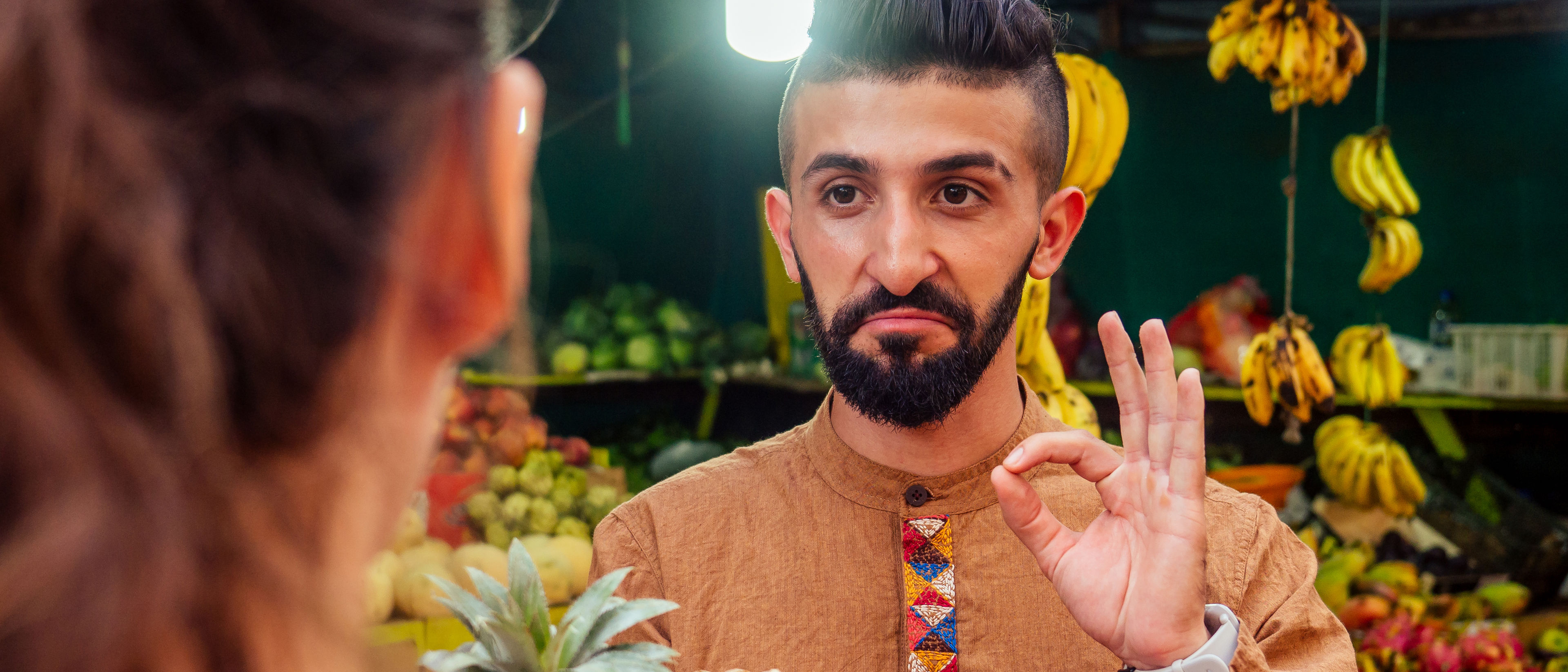 Man buying pineapple from the shop