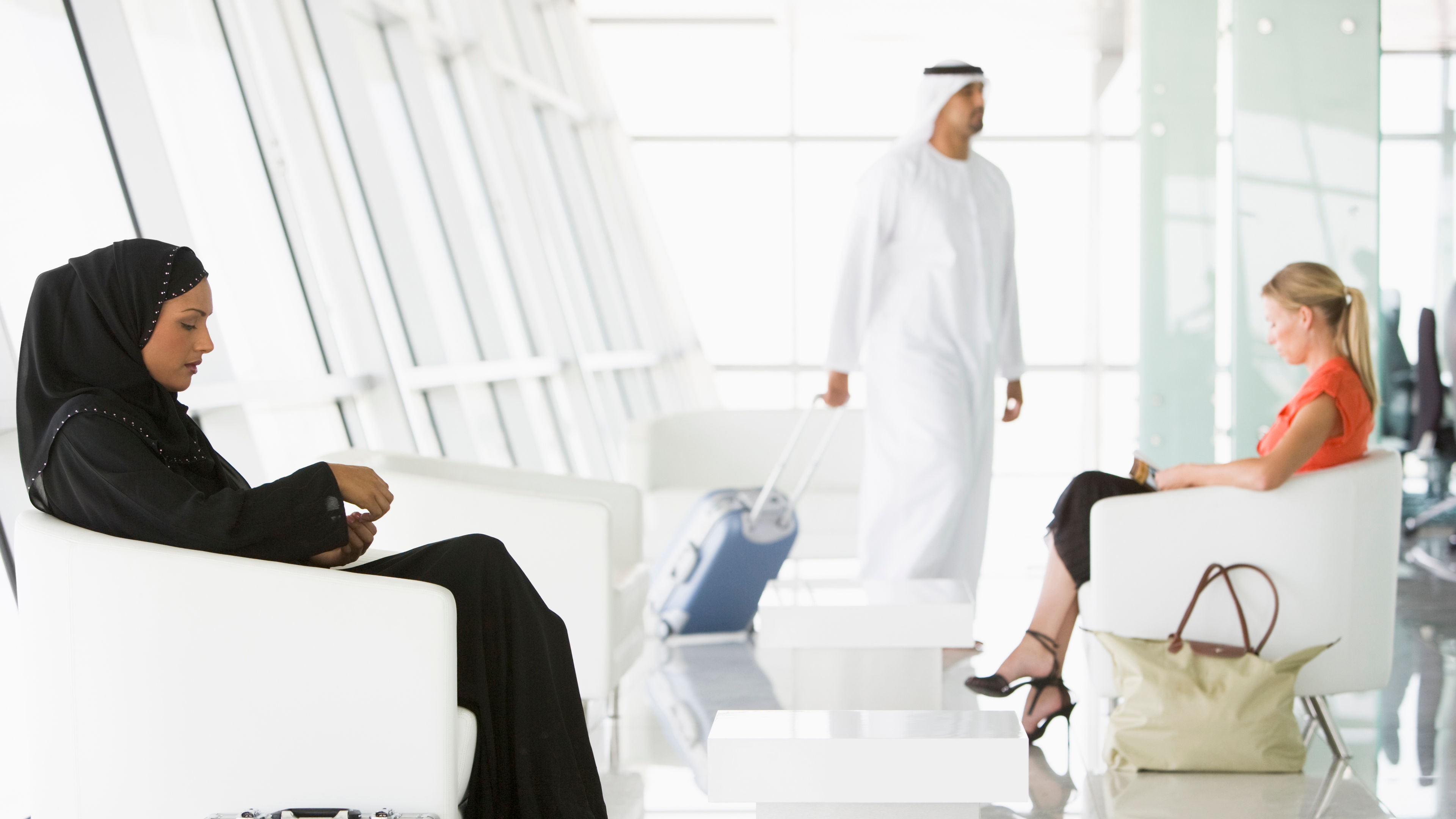 Passengers waiting in airport departure lounge