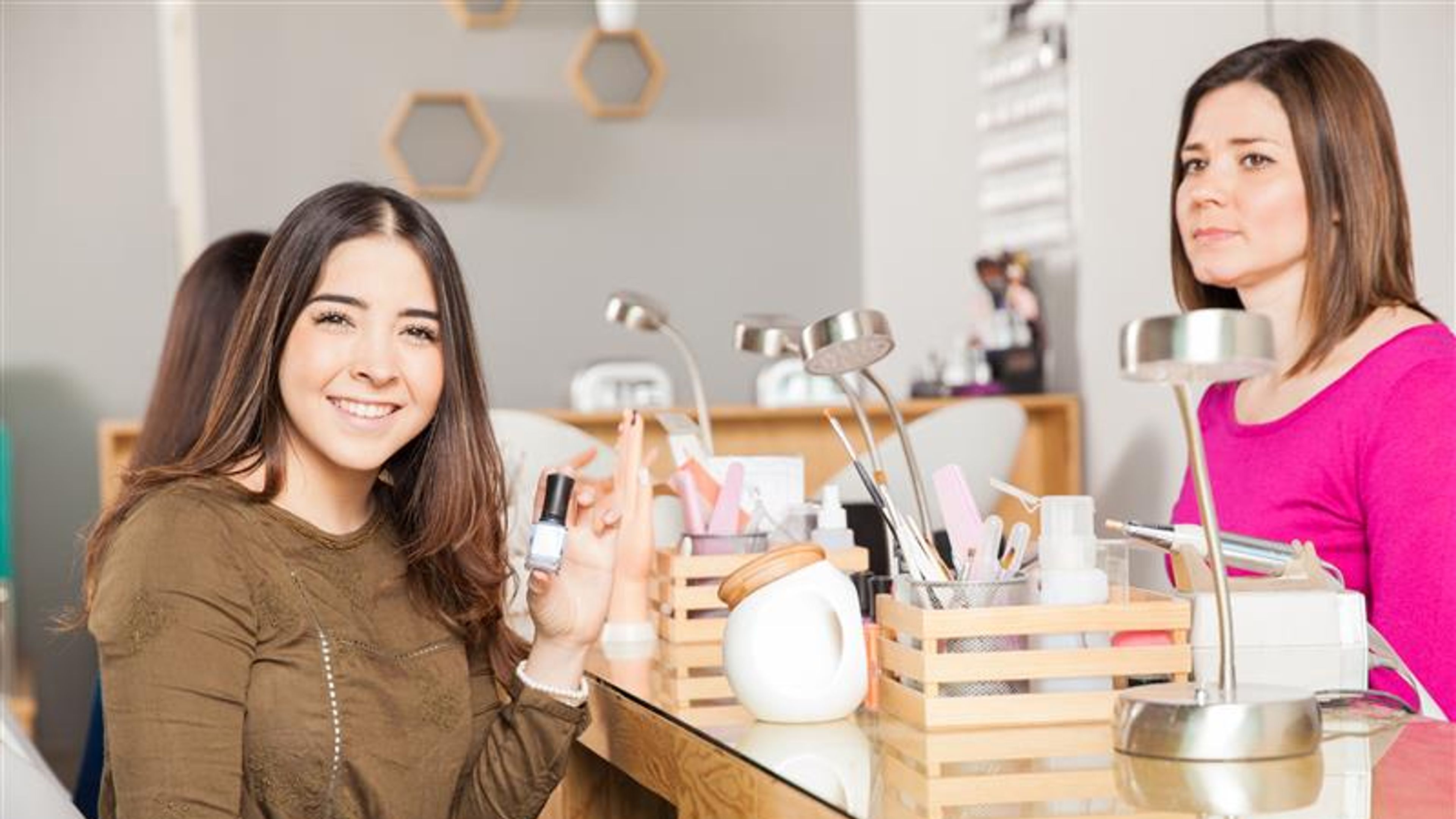 A woman at a nail shop