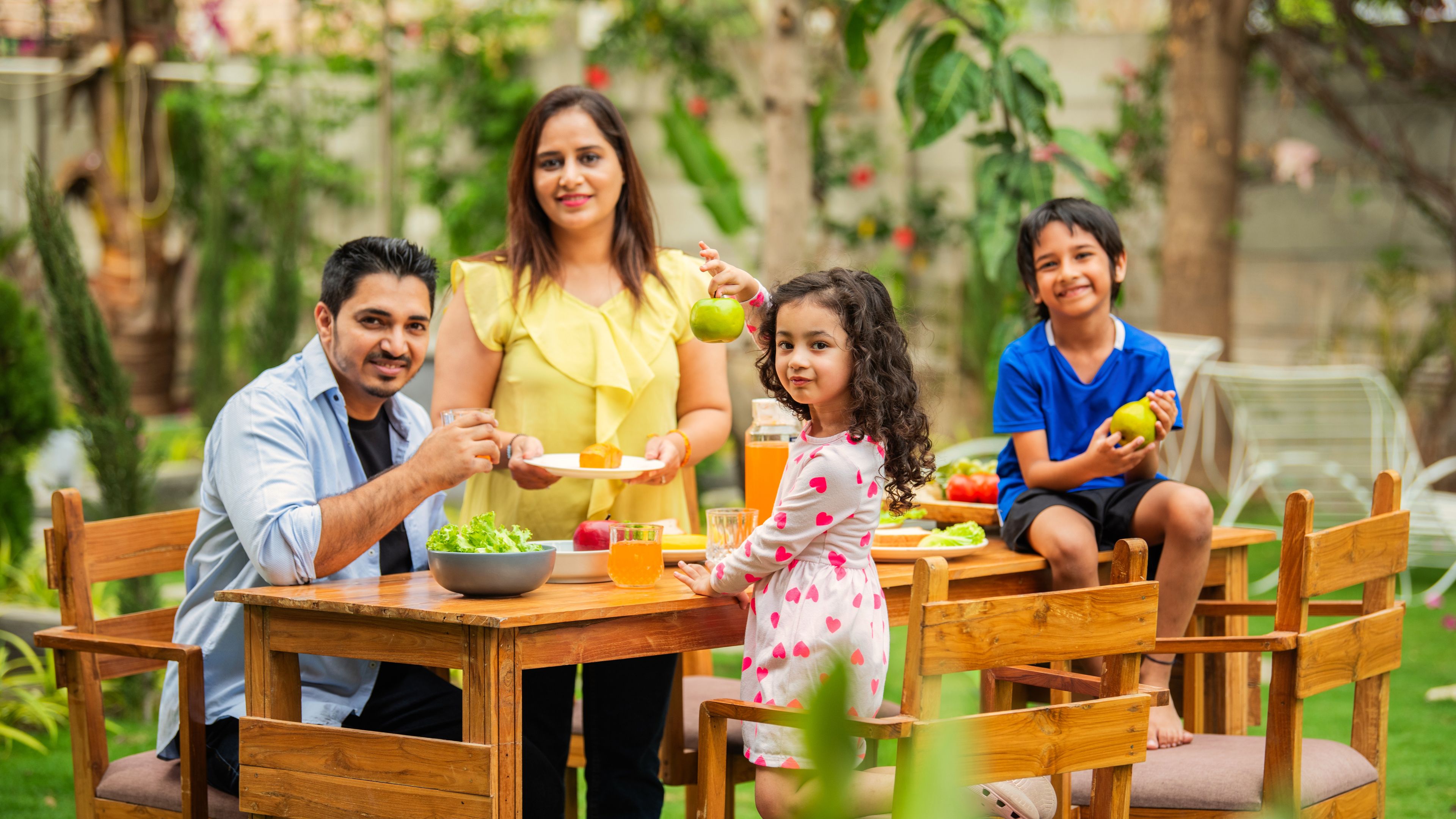 A family enjoying their breakfast.