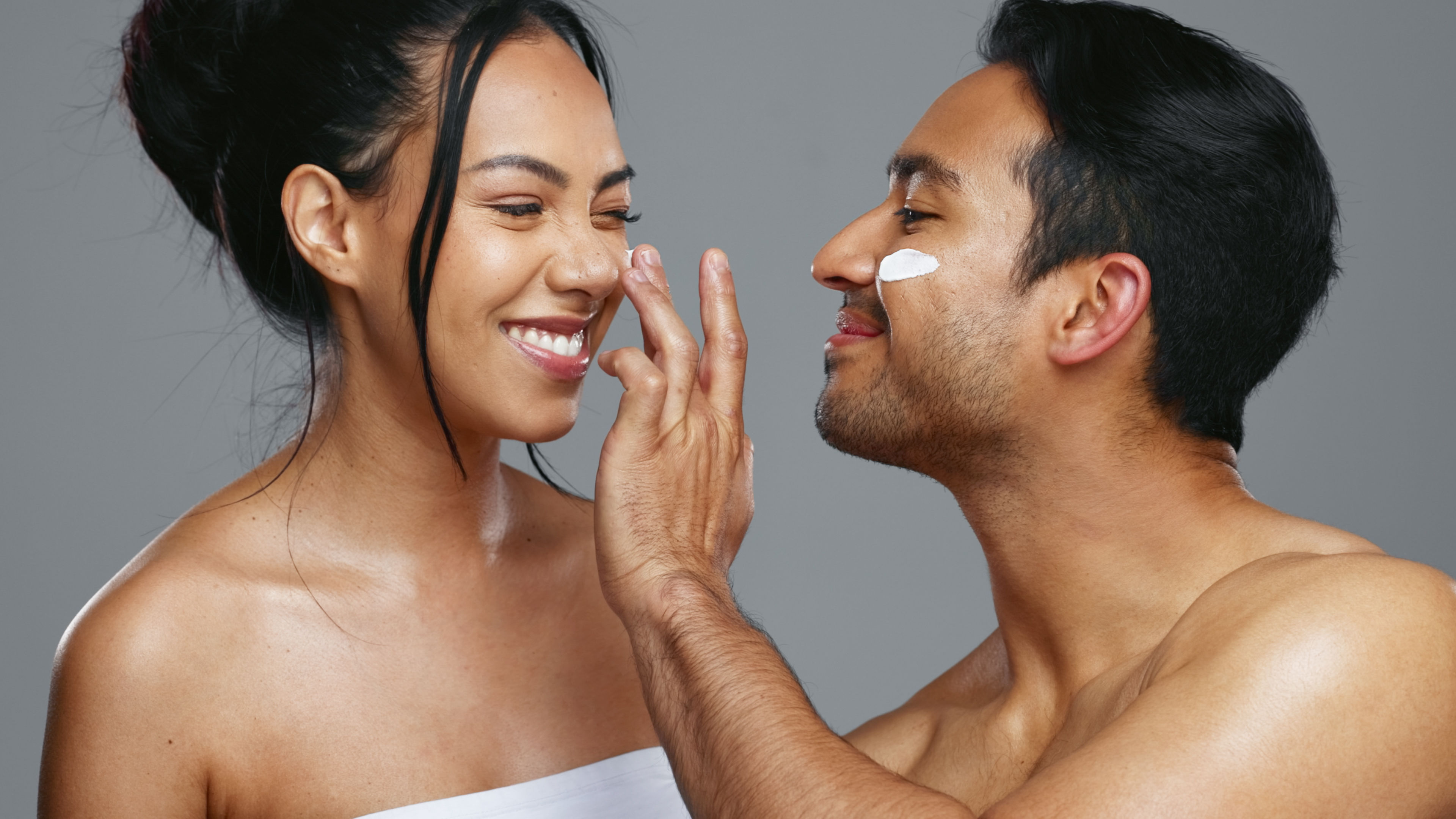 Couple doing skincare