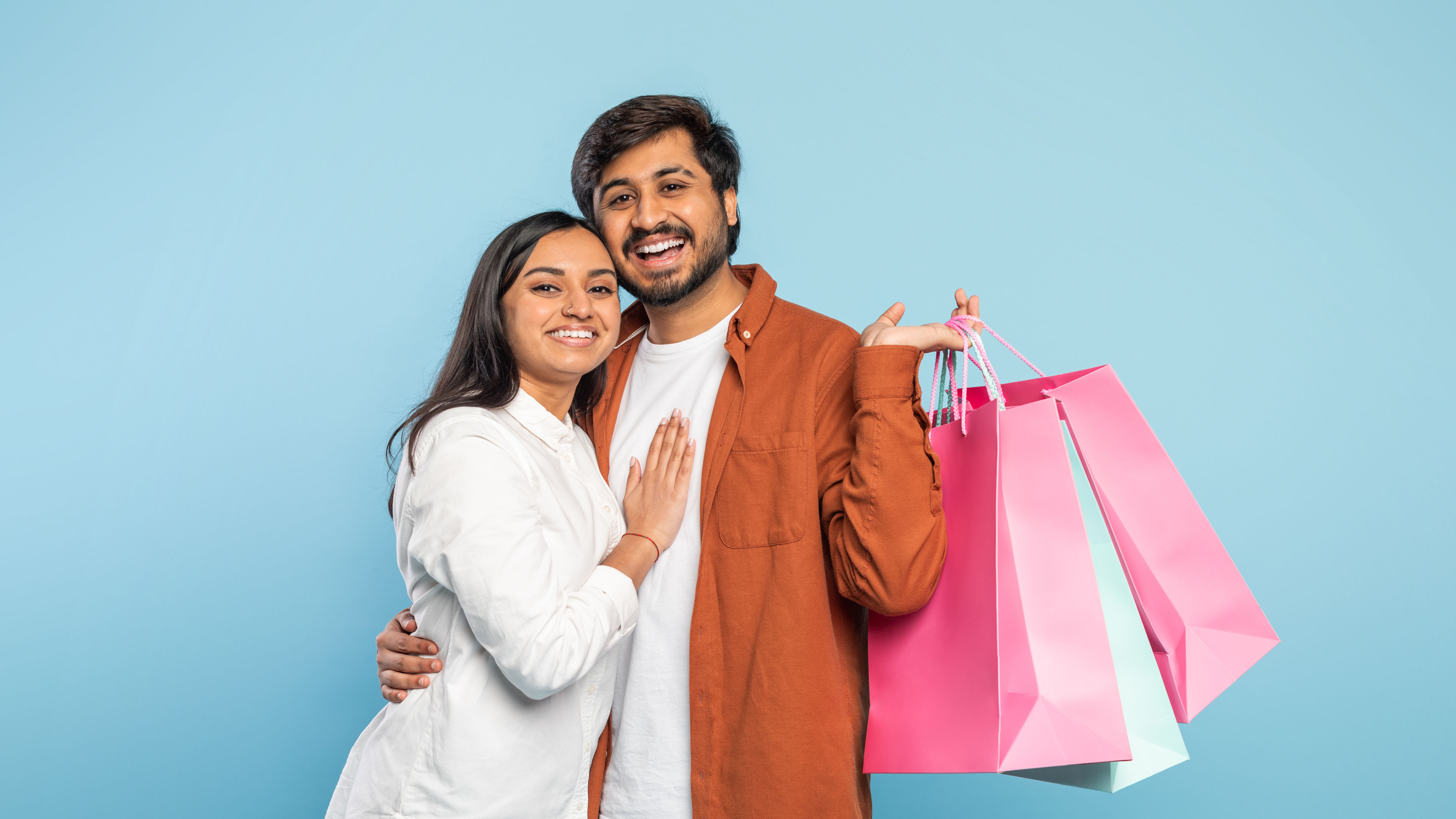 Couple holding shopping bags