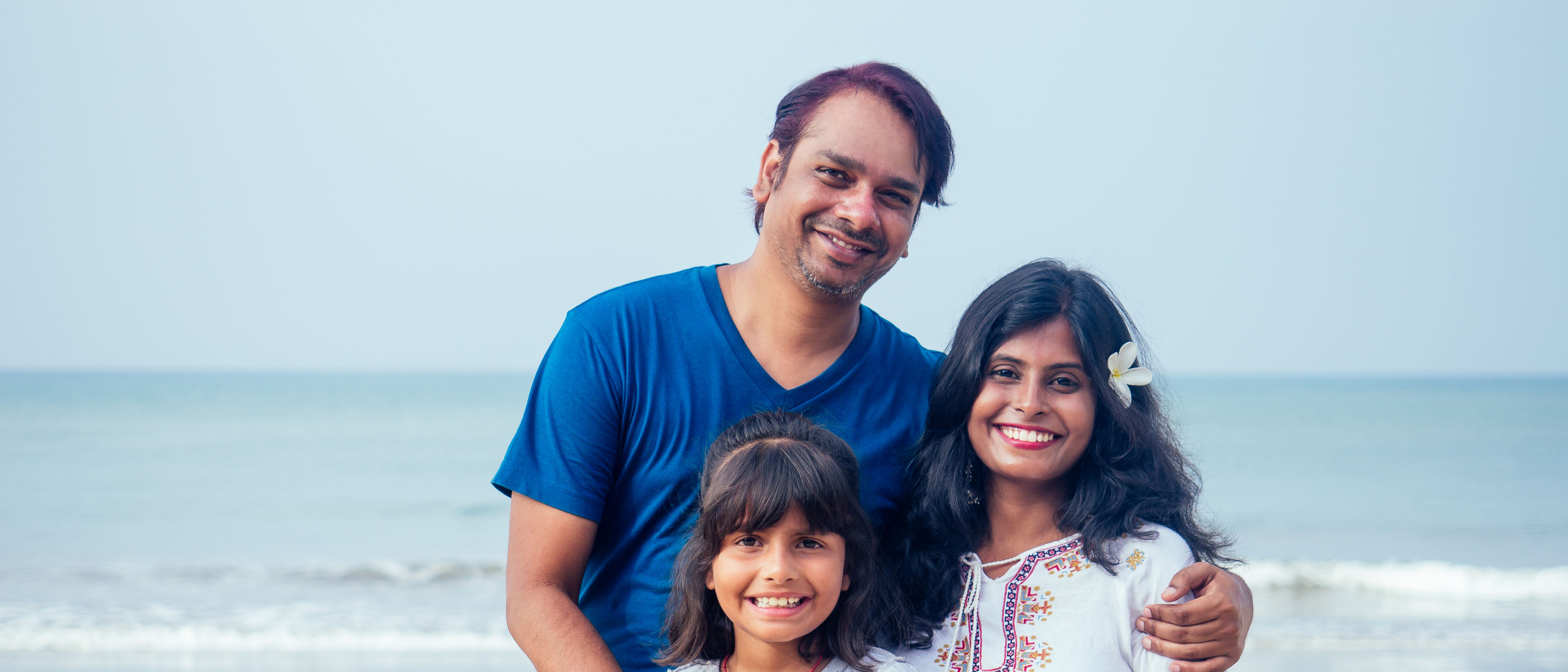 Family relaxing at the beachside