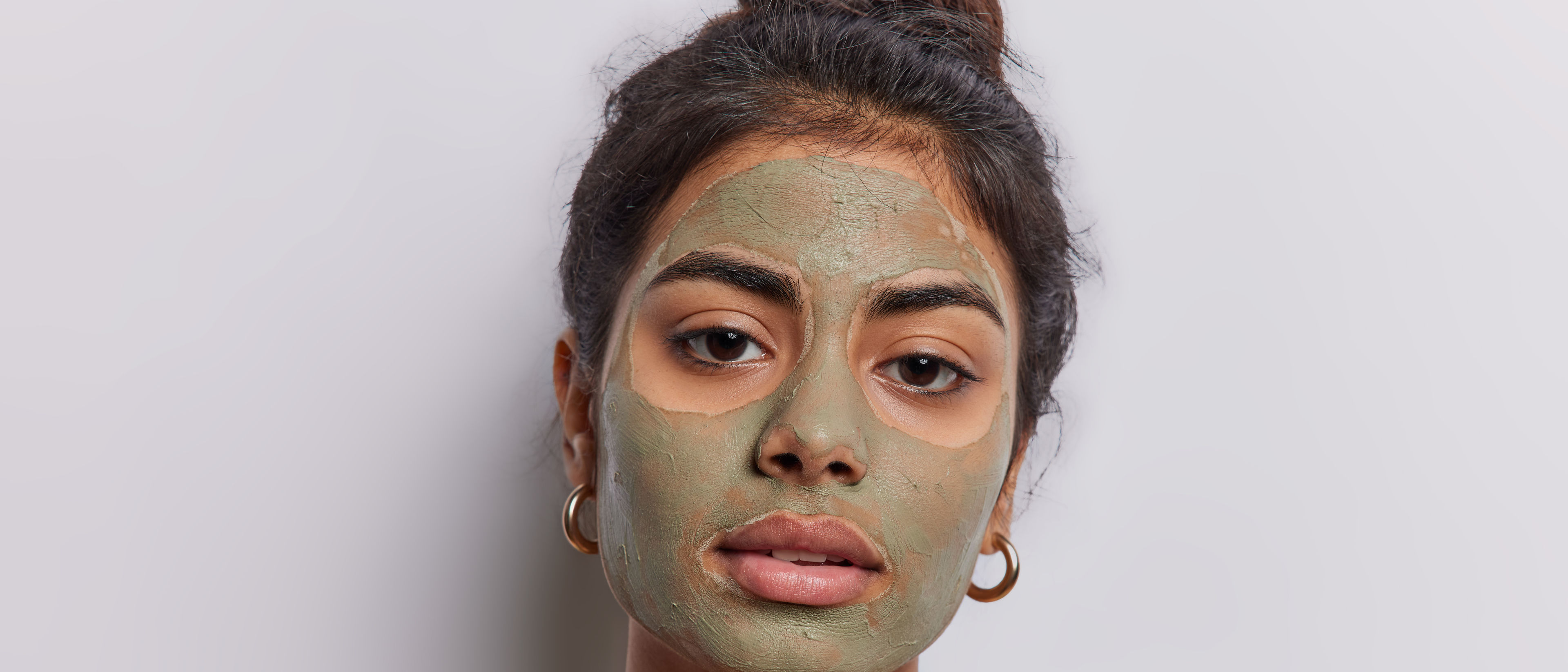 Woman applying face pack