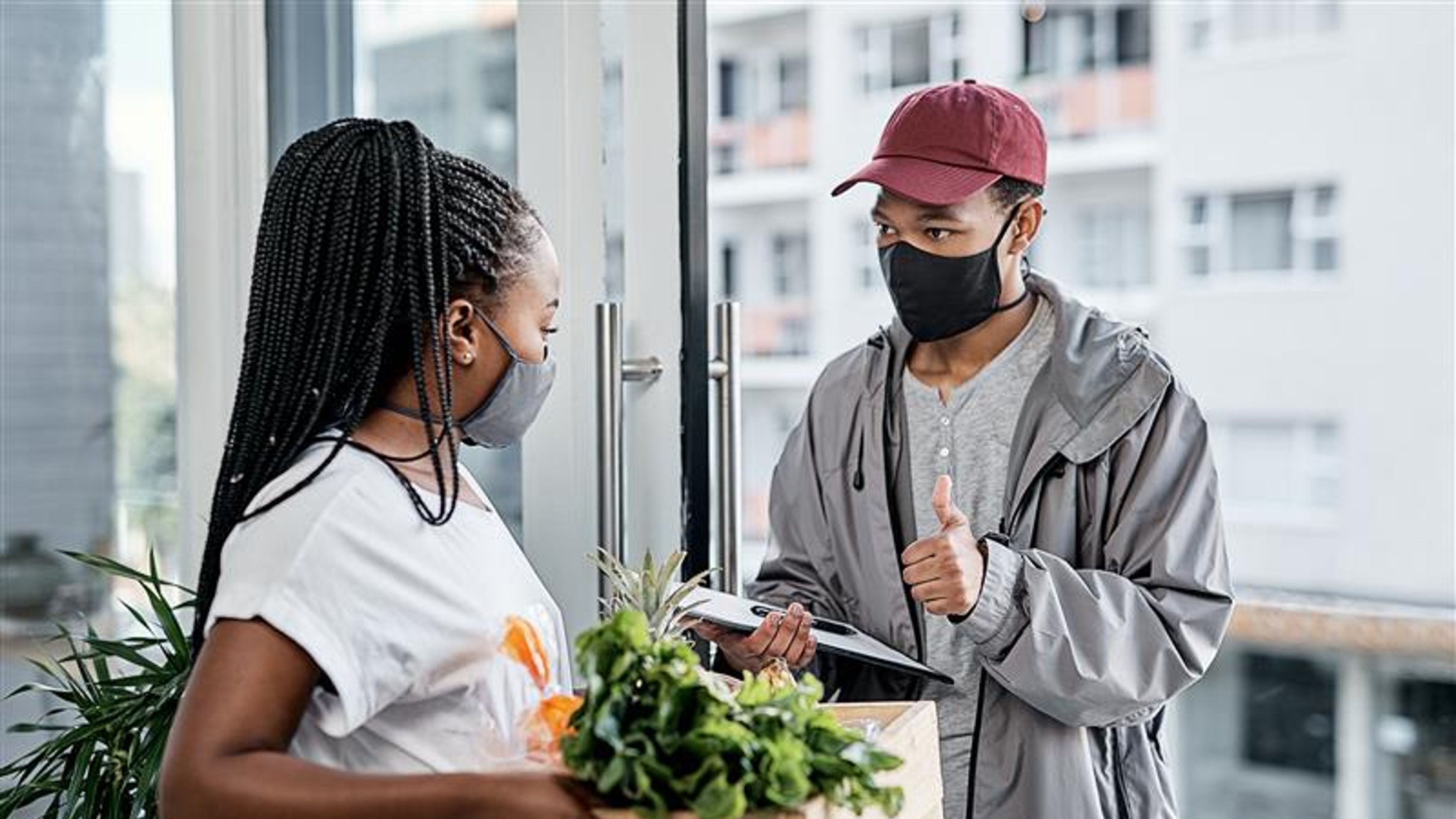 Young man showing thumbs up