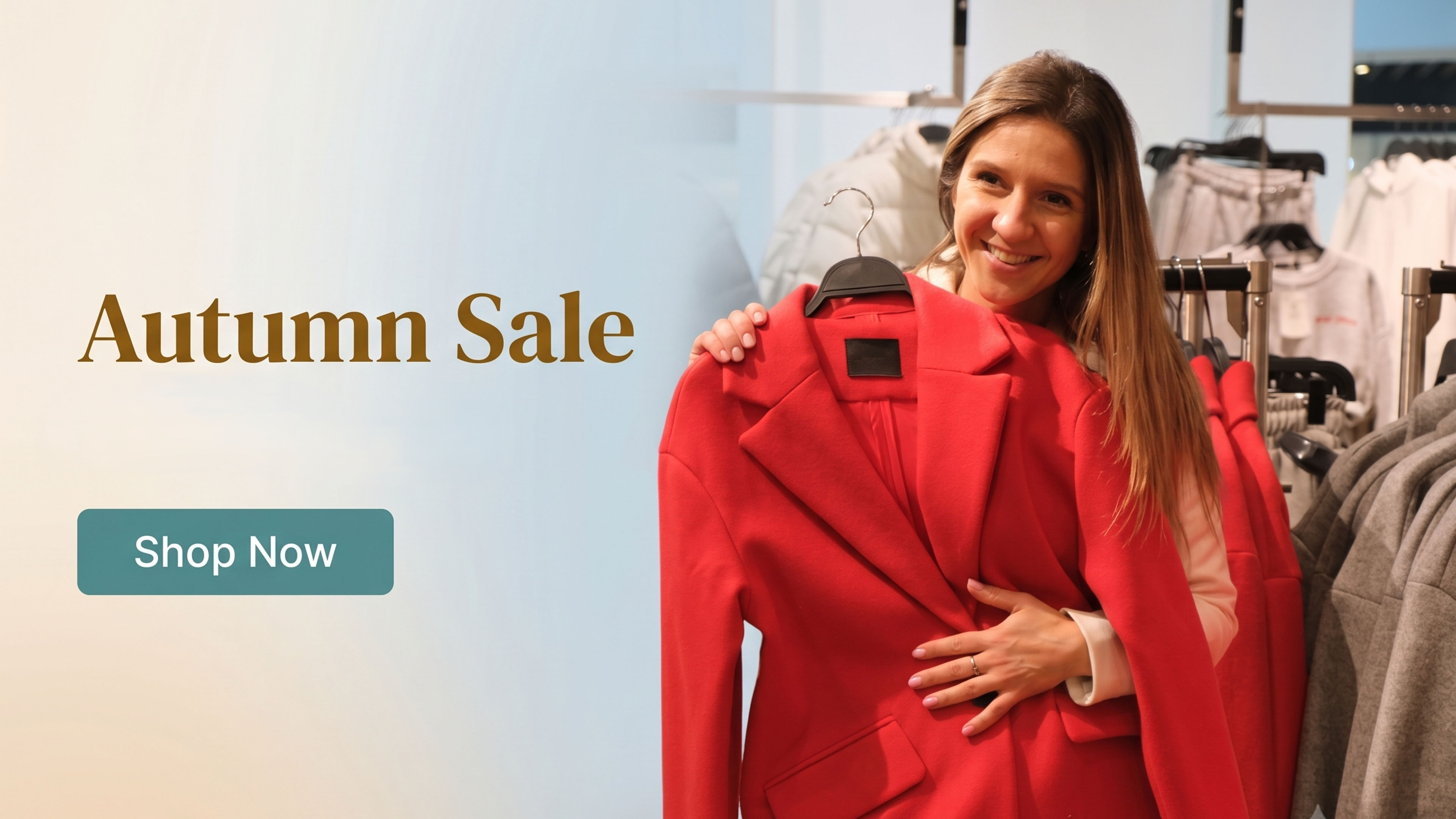 Woman Smiles Holding a Red Jacket in Store