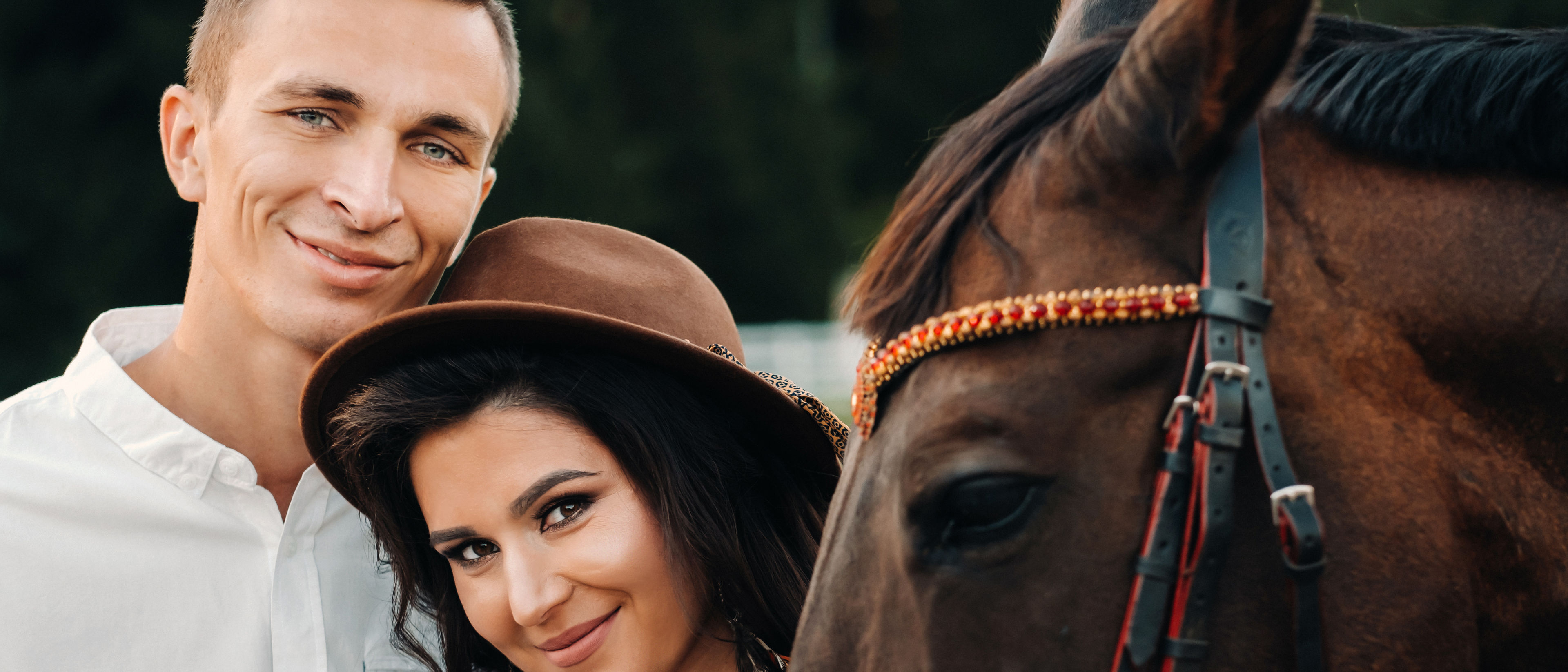 A couple near a horse