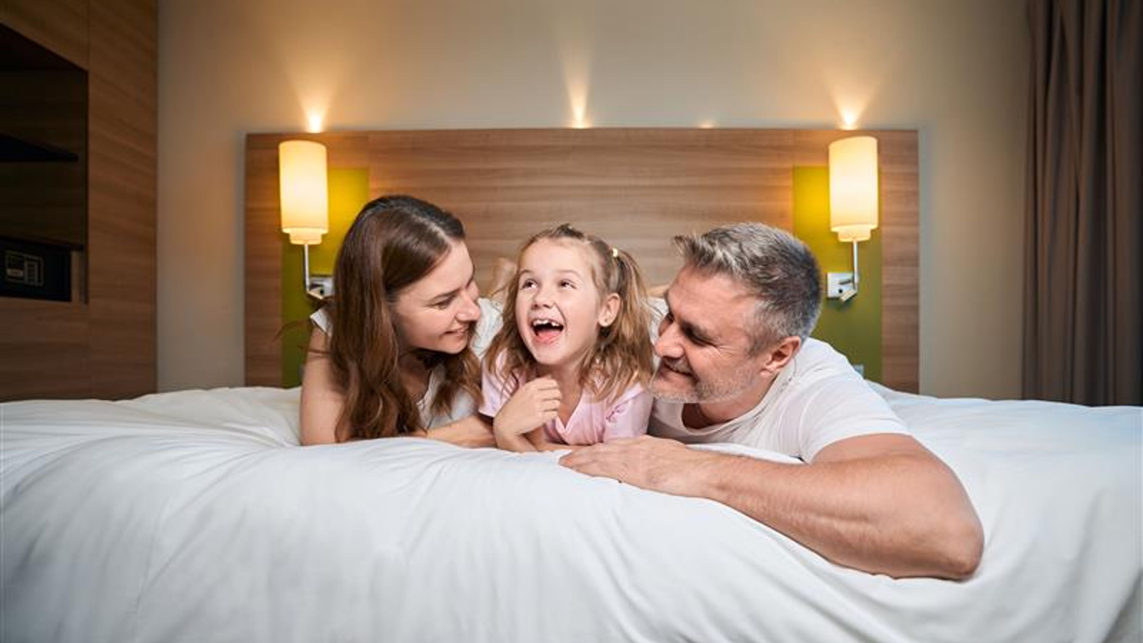 A family in a hotel room