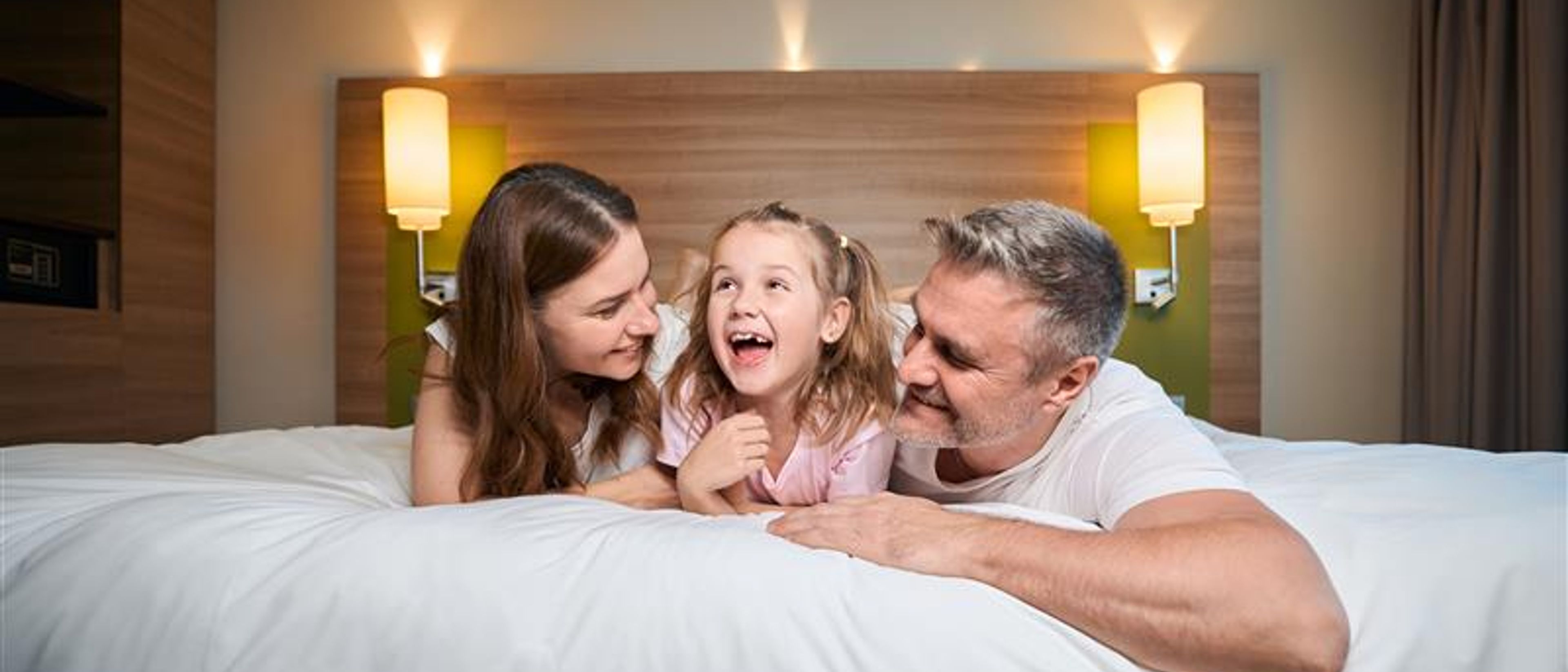 A family in a hotel room 