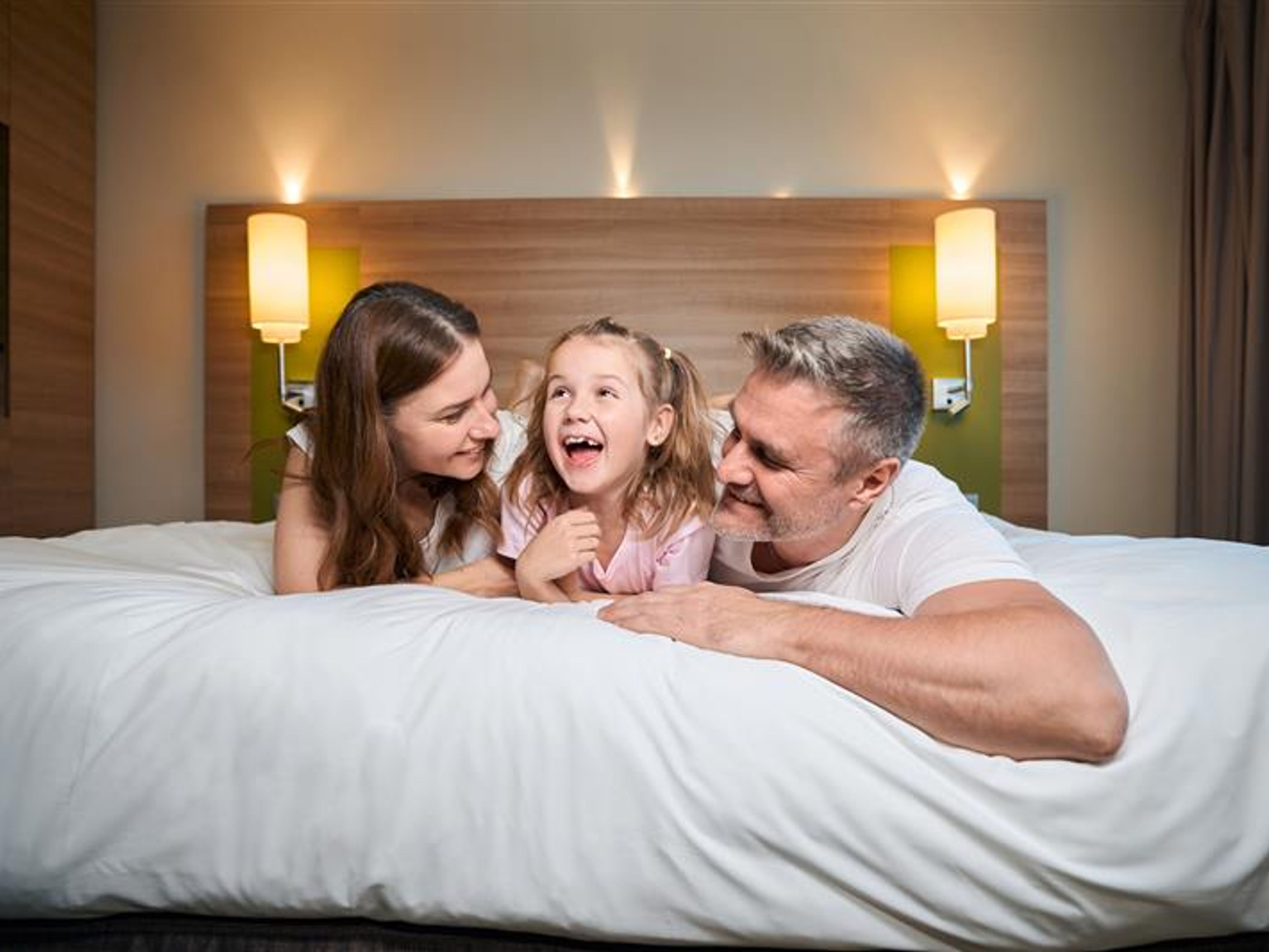A family in a hotel room 