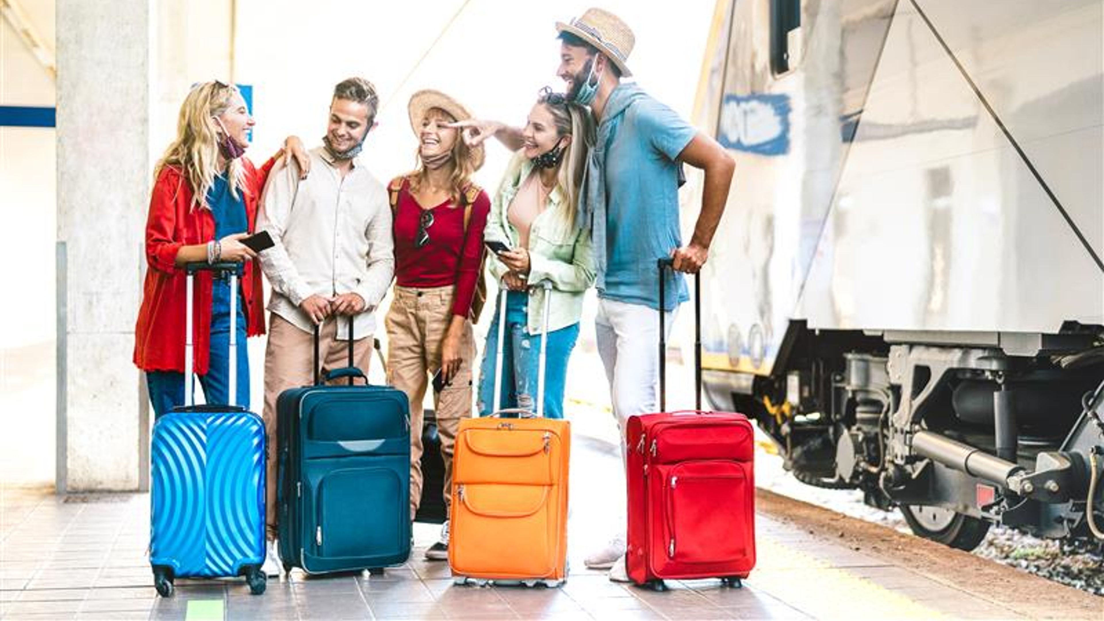A group of friends holding their cabin case