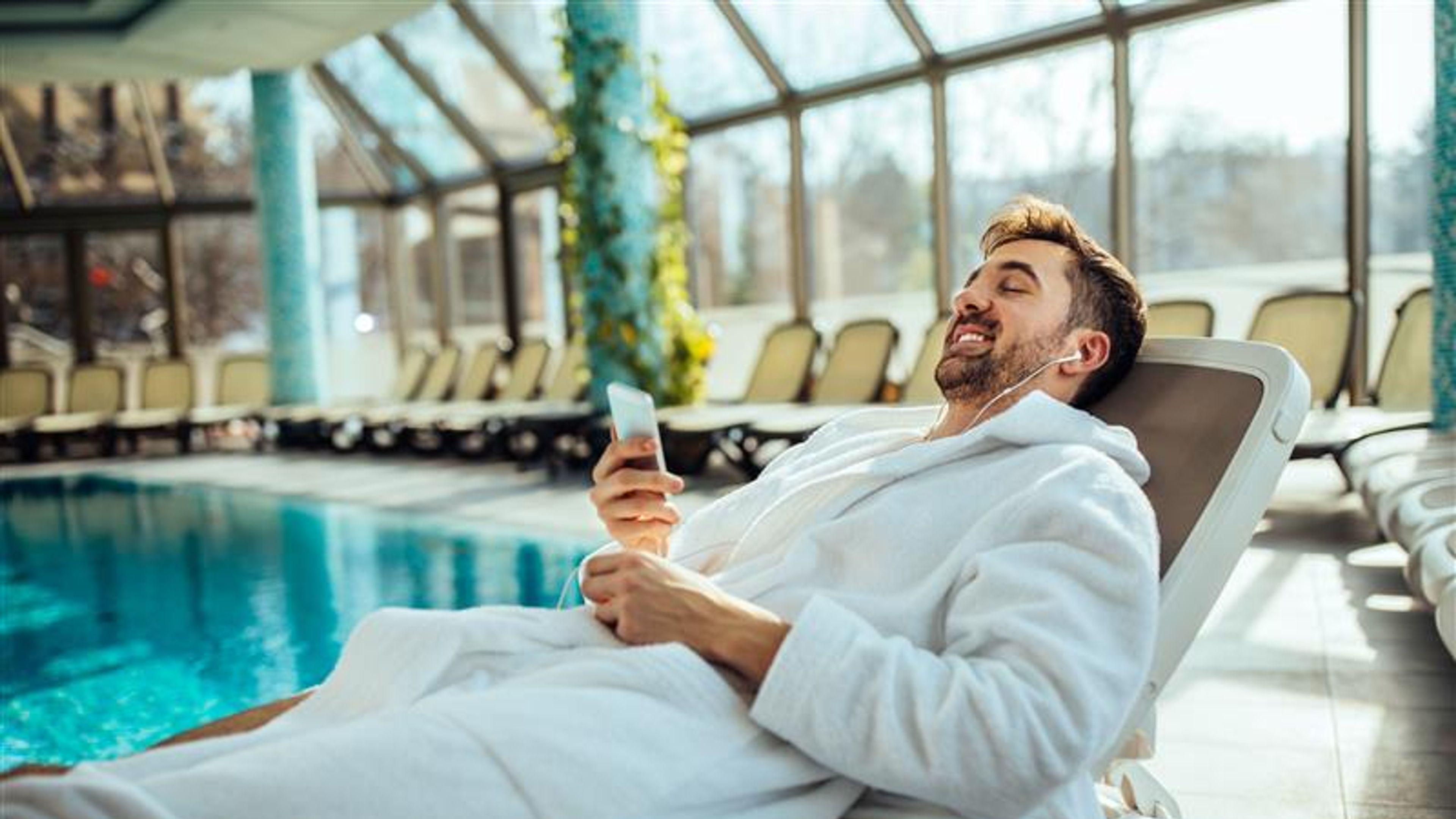 A man enjoying his time near a pool.