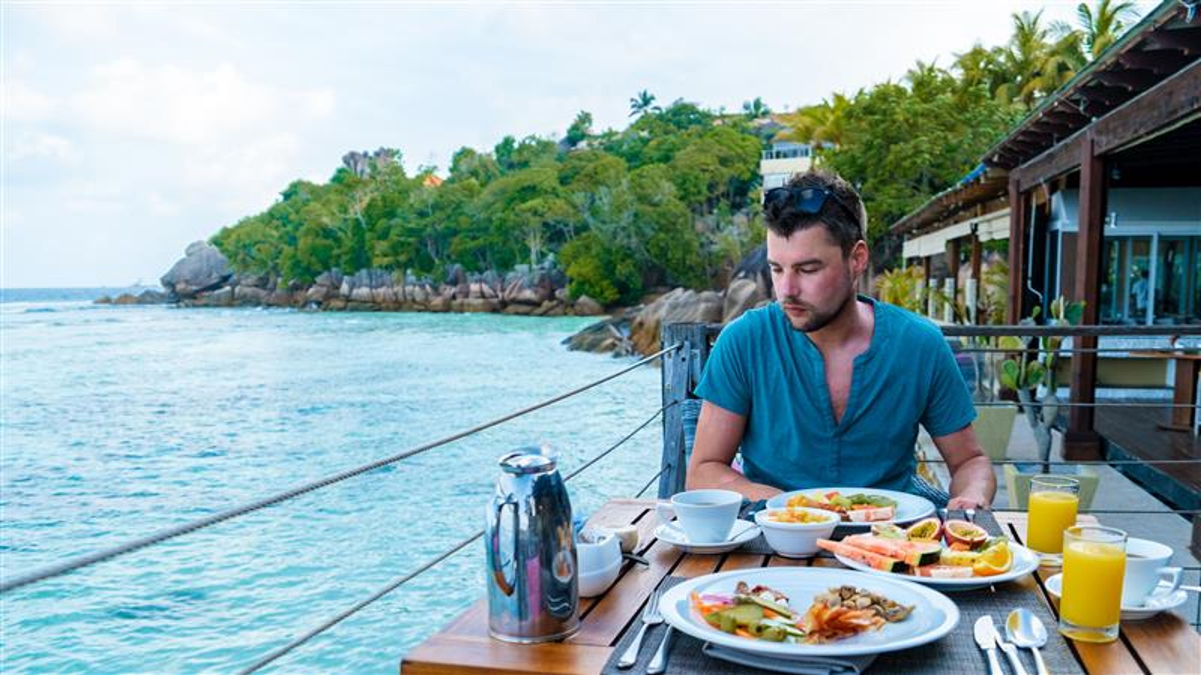A man having food in a hotel.