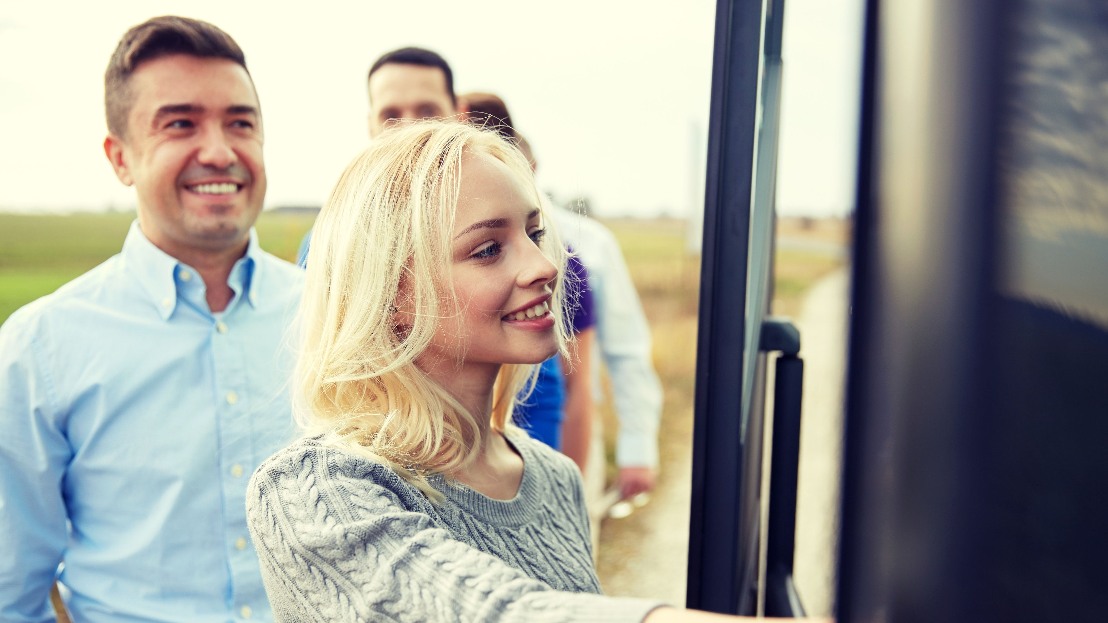 A woman getting into a bus